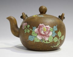 A Chinese Enammeled Yixing Stonewear Teapot and Cover, Qing Dynasty