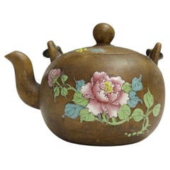 A Chinese Enammeled Yixing Stonewear Teapot and Cover, Qing Dynasty 