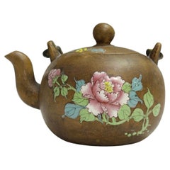 A Chinese Enammeled Yixing Stonewear Teapot and Cover, Qing Dynasty