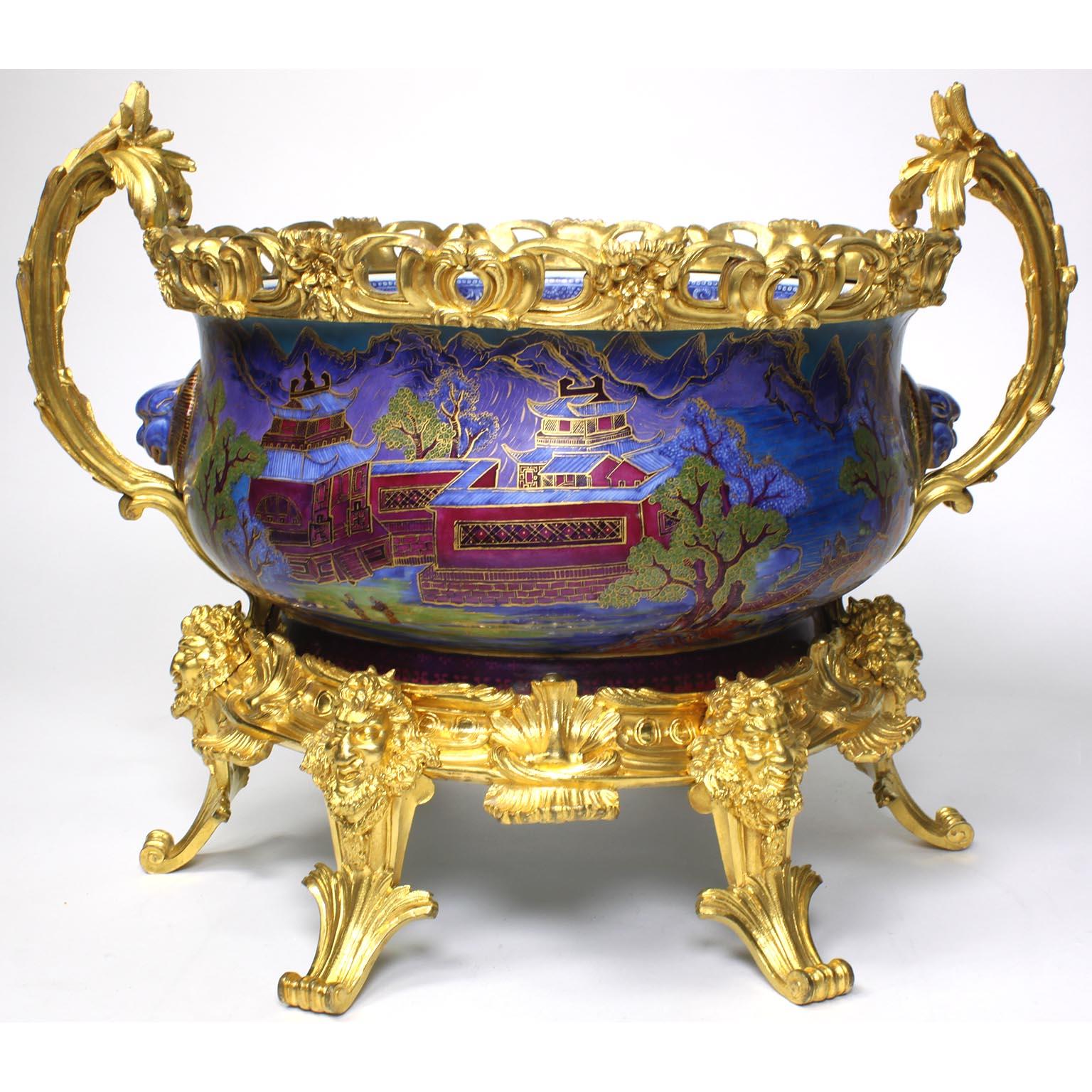 A very fine and large 19th century Chinese export famille verte porcelain and French figural ormolu-mounted Chinoiserie style centerpiece jardinière, in the manner of Edward Holmes Baldock (1777-1845). The circular-ovoid porcelain bowl or cachepot,