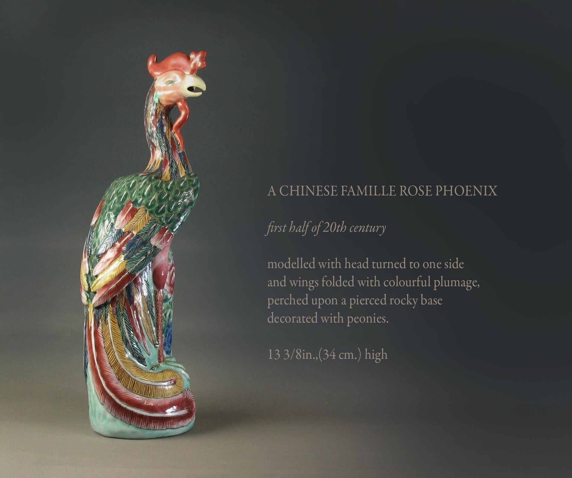 A Chinese Famille Rose Phoenix

First half of 20th century.

Modelled with head turned to one side 
and wings folded with colorful plumage,
perched upon a pierced rocky base 
decorated with peonies.

Measures: 13 3/8in.,(34 cm.) high.