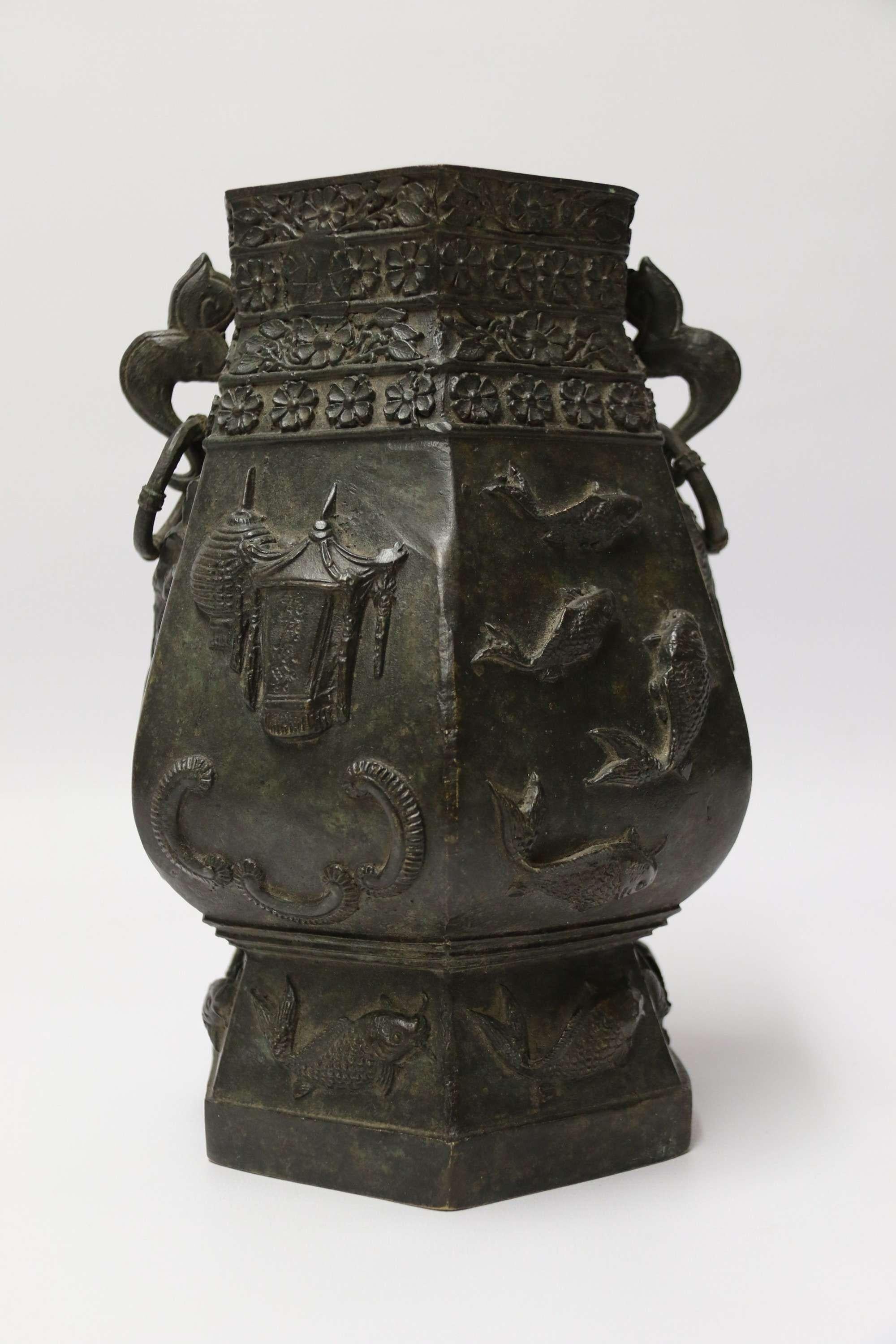 A Chinese Finely Cast 19th century bronze vessel

This bold and stylish Chinese shaped hexagonal vessel is heavily cast in solid bronze. It has a very pleasing shape which is enhanced by the pair of decorative ring handle mounts to each side. At