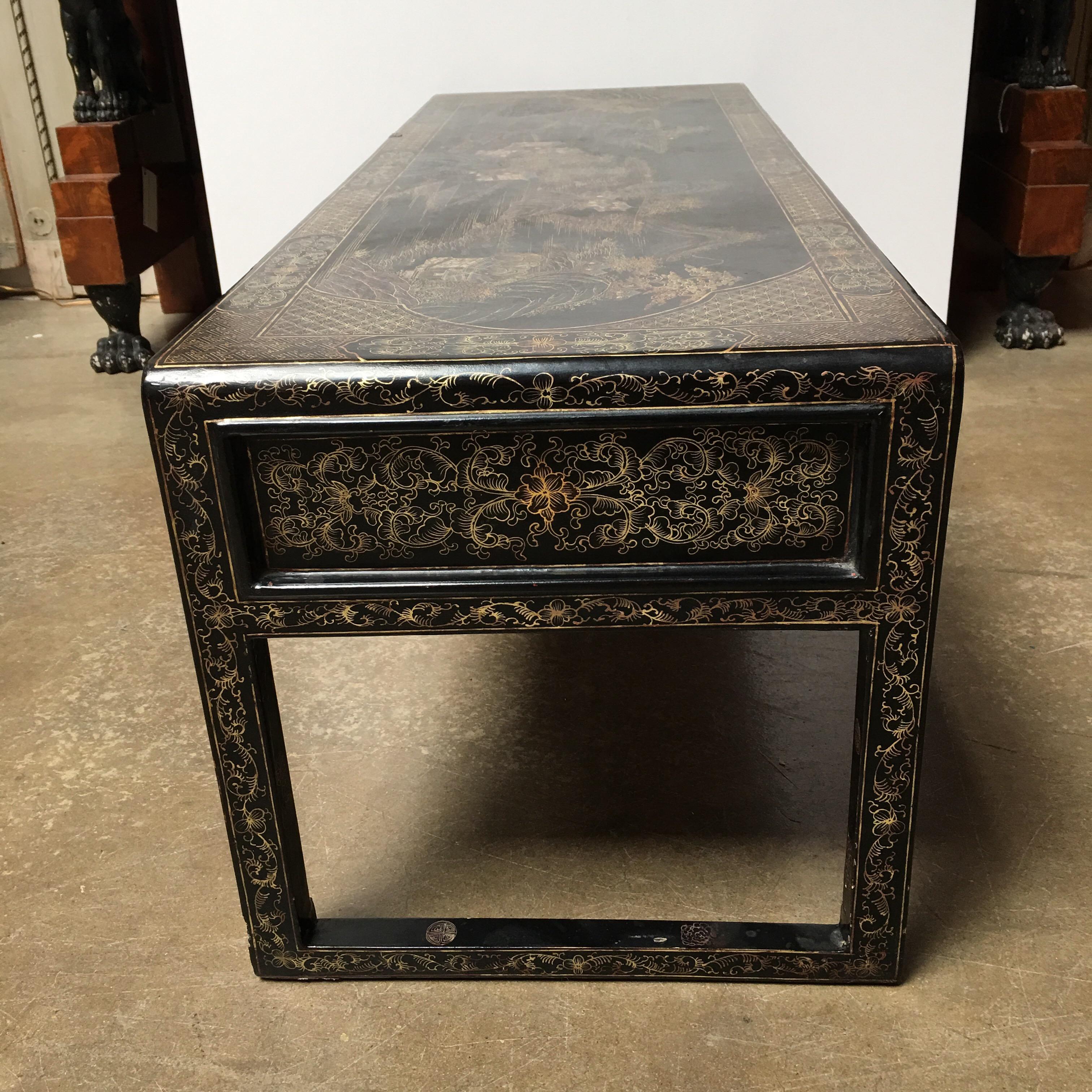 A Chinese lacquered low table.