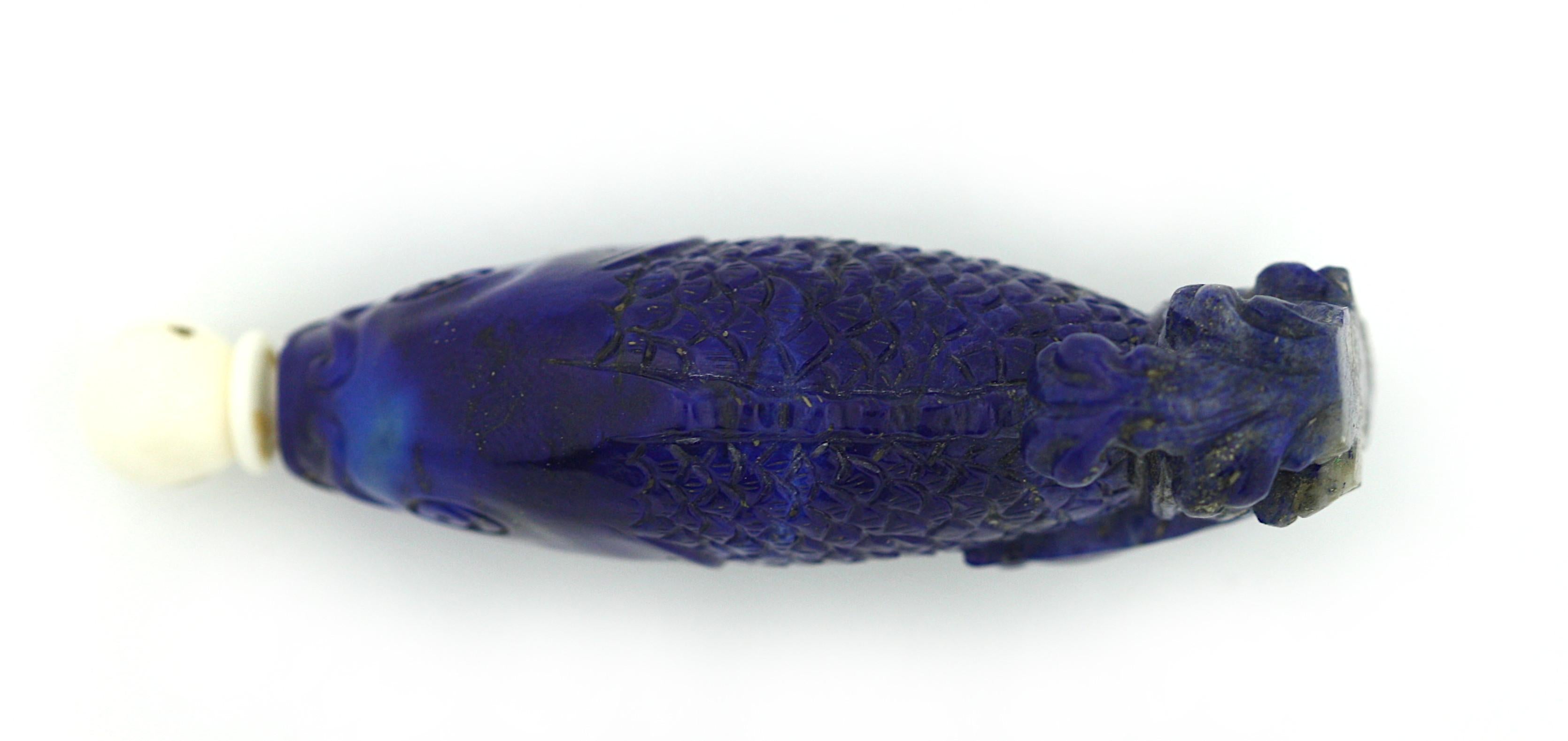 A Chinese Lapis Lazuli Snuff bottle
20th century
Carved in the form of a leaping carp, has stopper
Measures: 6.3 cm, 2 1/2 in.