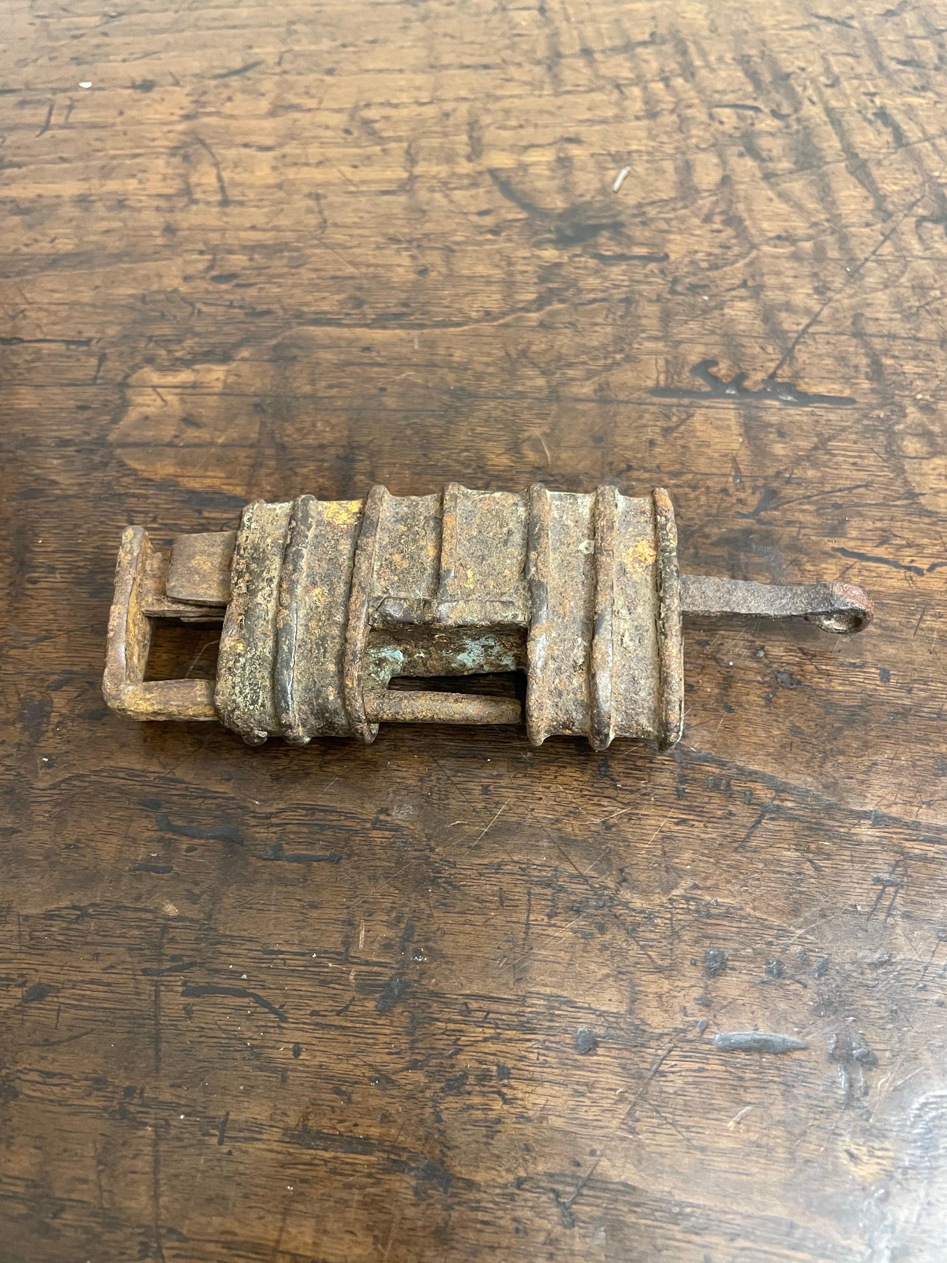 A Chinese Metal Lock with Key, Late 19th Century

Provenance: Private Brisbane Collection.

Dimension: Height: 5cm Length: 14cm Depth: 2cm.