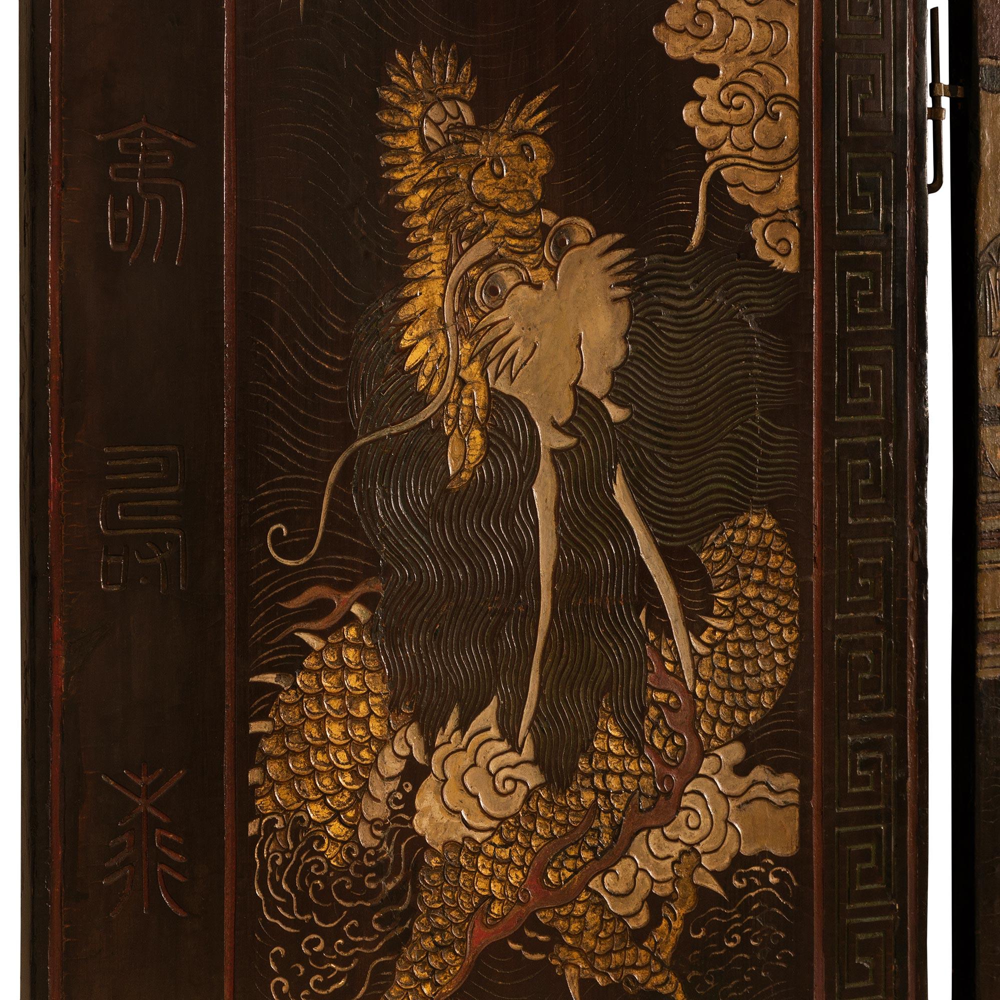 Wood A Chinese mid 18th century Laquered Coromandel screen For Sale