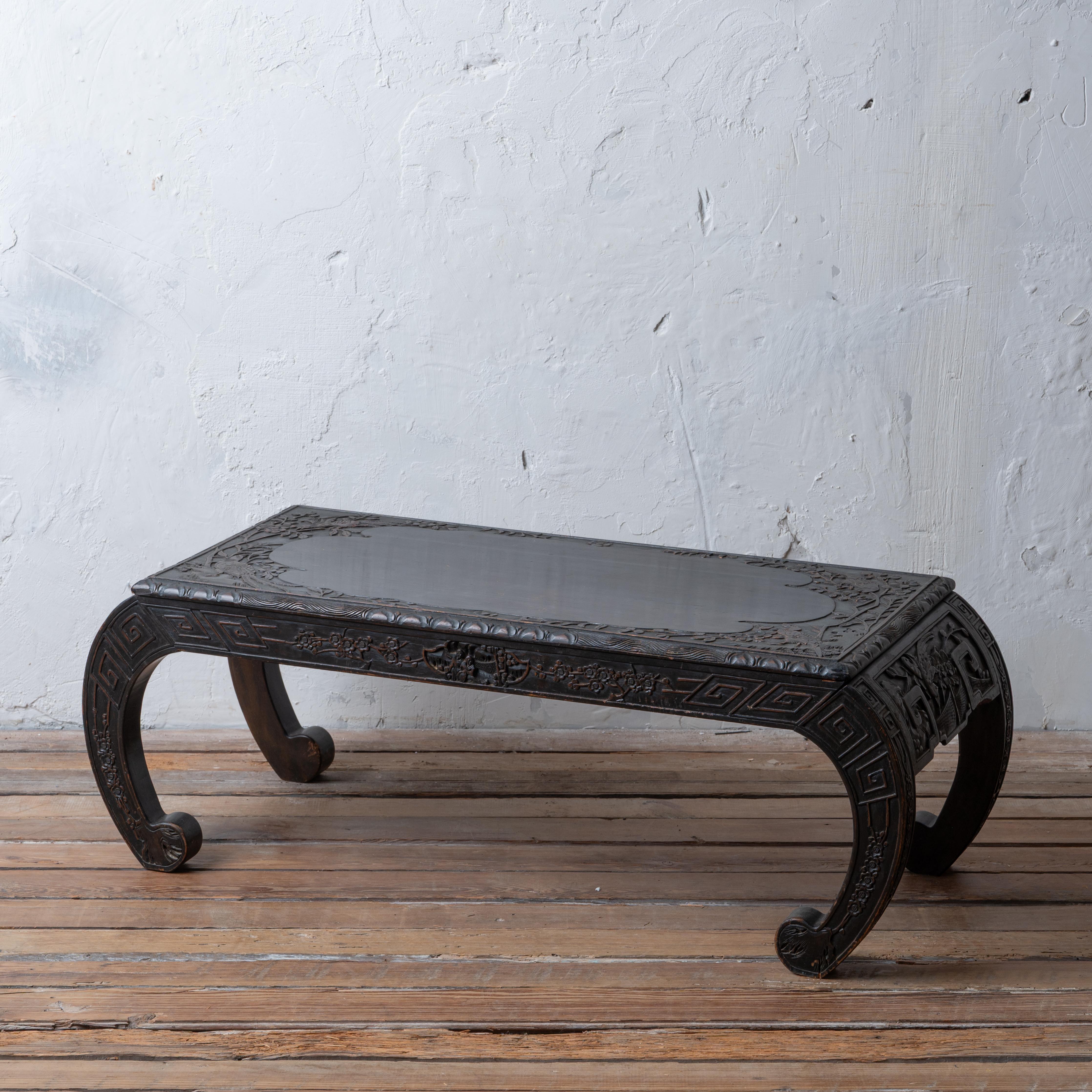 A Chinese hardwood opium table, circa 1930s.



39 ¾ inches wide by 16 inches deep by 14 inches tall



