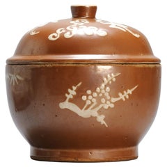 A Chinese slip-decorated brown-glazed 'three friends of winter' Jar and cover