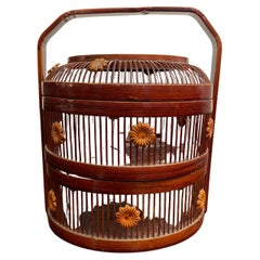A Chinese Two-Tiered Bamboo and Rattan Lidded Dessert Basket with Handle