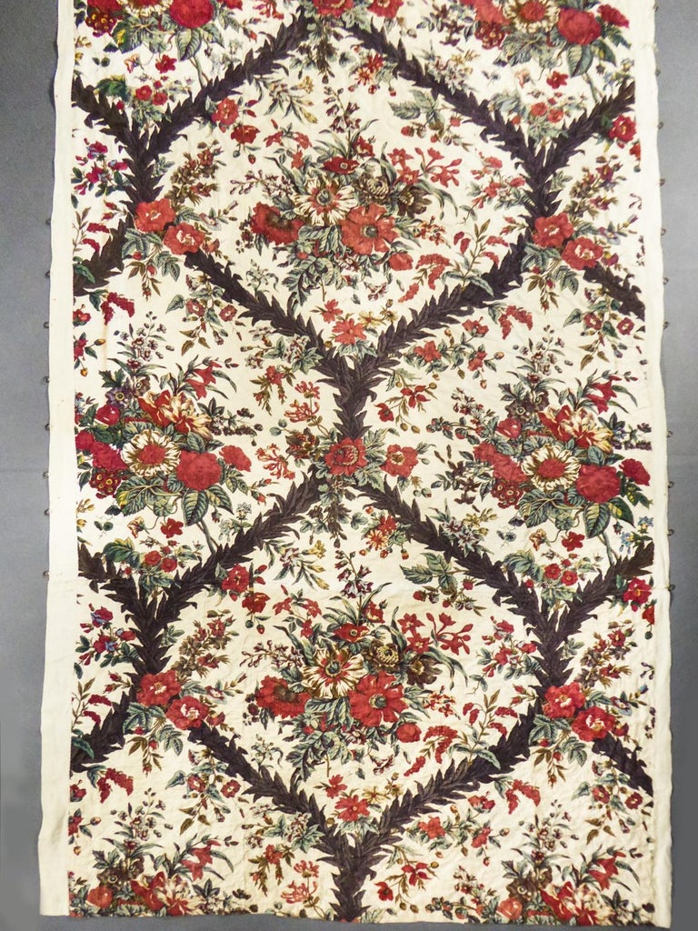 Circa 1800-1820
Alsace or Swiss Manufacture

Rare Quilted polychrome Indian bedspread dating from the early 19th century. Large naturalistic decoration with floral bouquets presented in large medallions framed by interlacing leaf stems. Large ratio