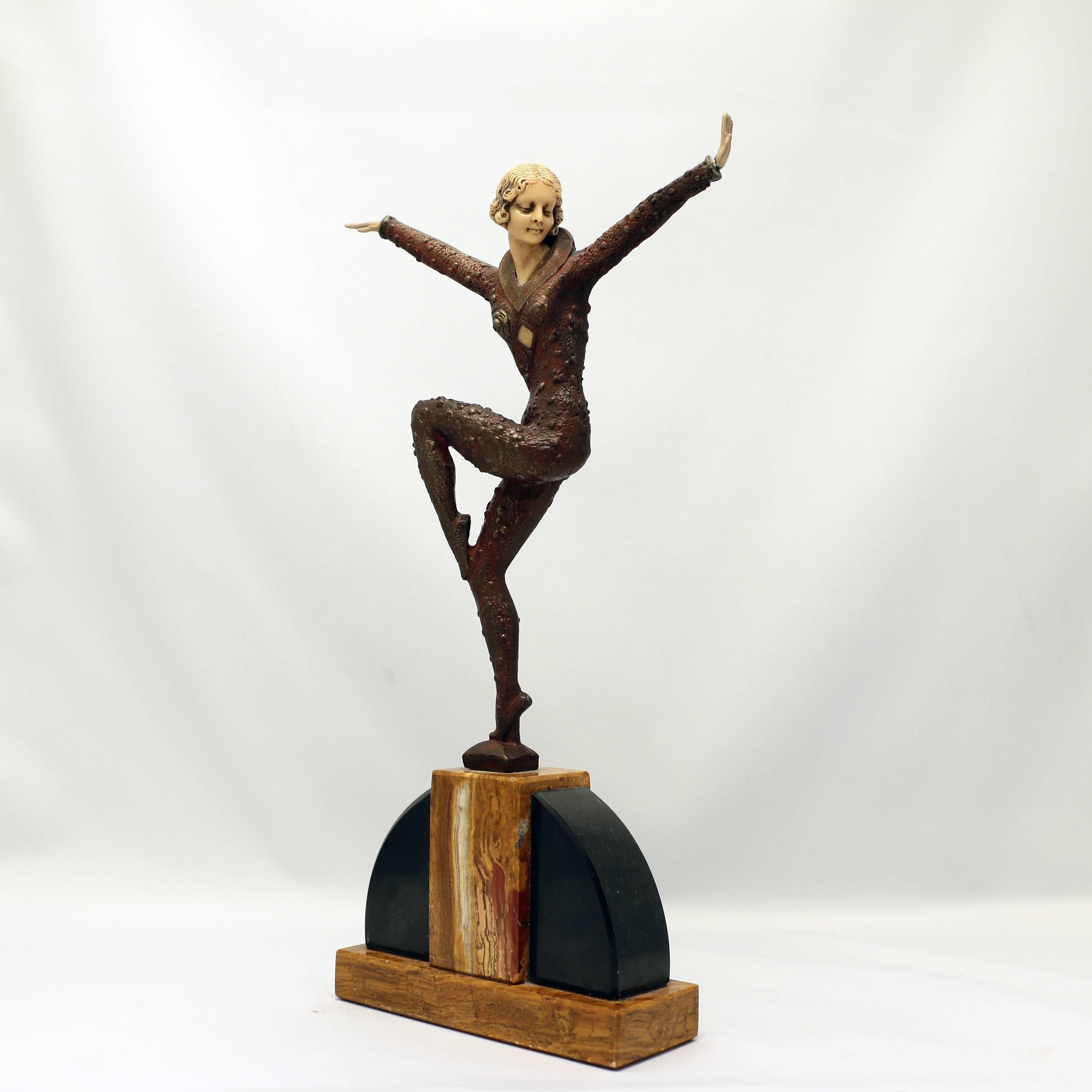 This finely scupted bronze figure draws on the Ballet Russe for inspiration.. The slender young woman,with arms and one leg raised en retiré, exoticly dressed and on marble  base  evokes the great days of the sensational company.. The cold painted