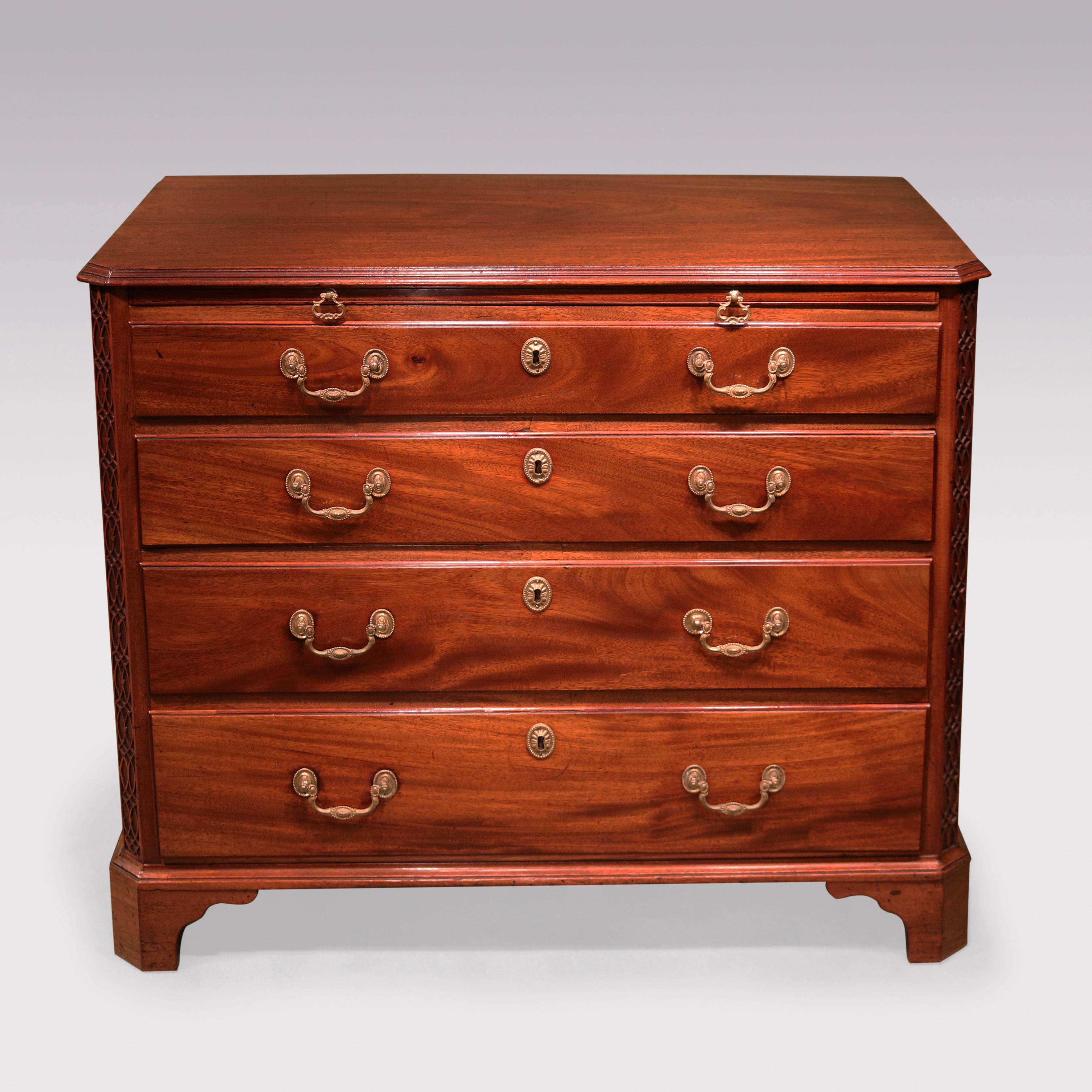 A mid- 18th Century Chippendale period figured mahogany straight front Chest, having moulded edged top above brushing slide & 4 graduated drawers, flanked by blind fret canted corners supported on shaped bracket feet.