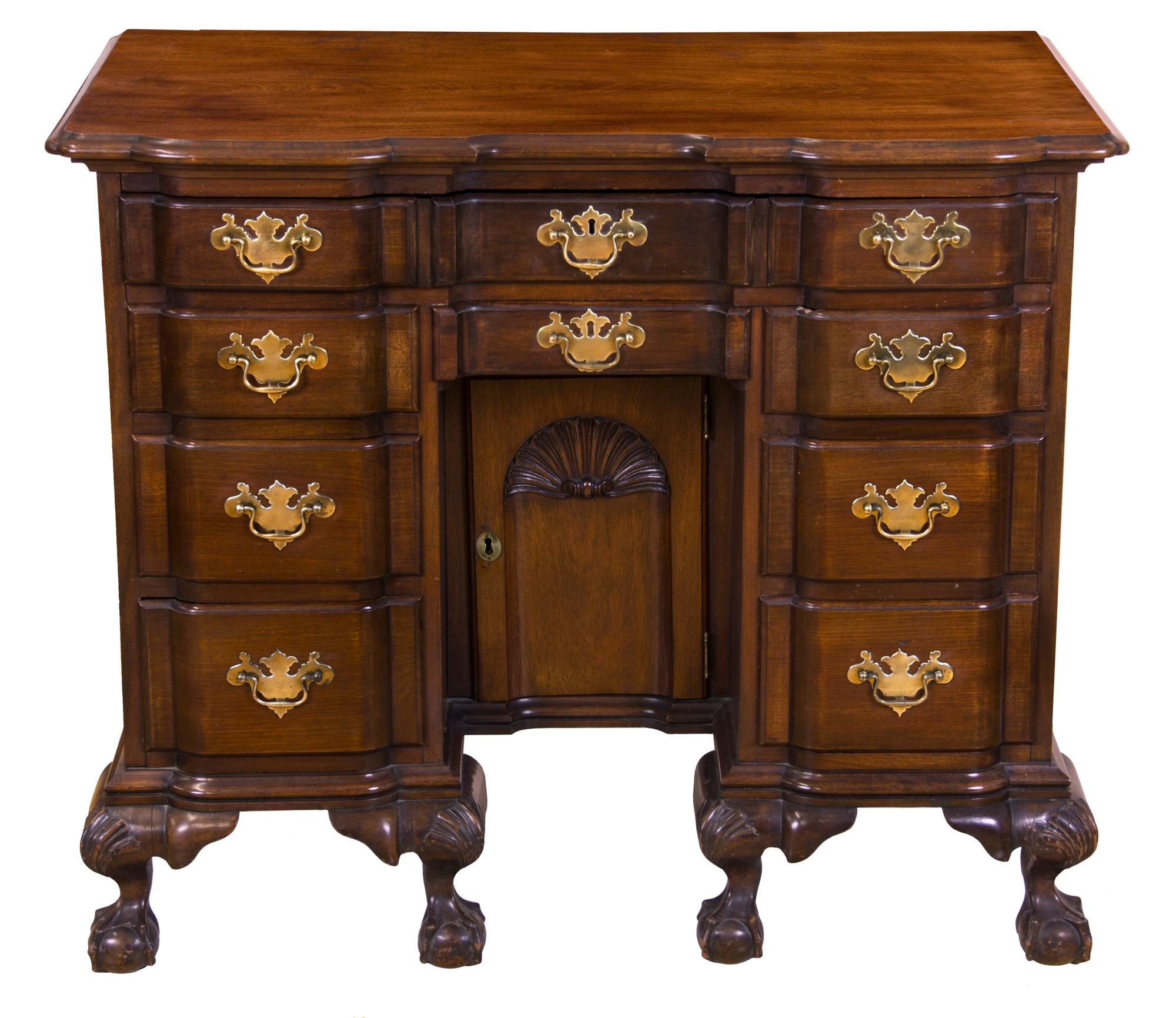 While non-period furniture is something we rarely, if ever, offer, this kneehole desk is an exception. It is handmade and, quality-wise, is as Fine as a period example. Note the magnificent shell on the tombstone door. The Claw and ball feet are