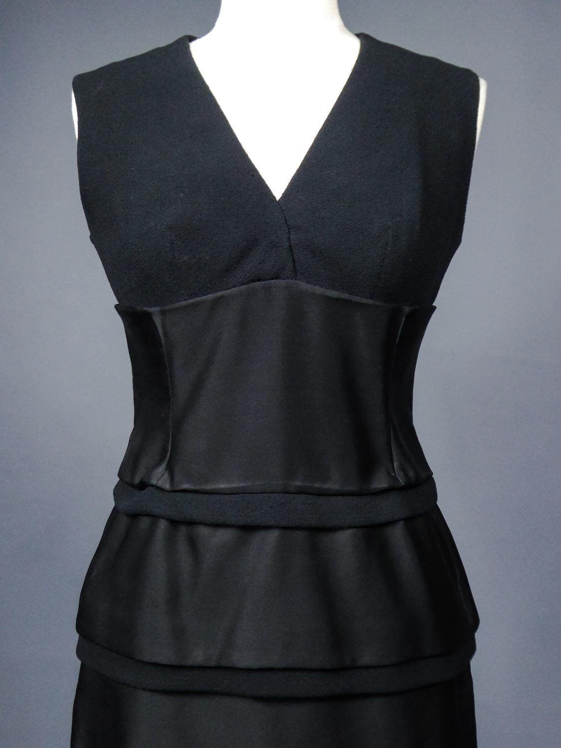 Collection Autumn Winter Fall 1961
France

A Christian Dior Haute Couture little black cocktail dress of the first season of Mr. Marc Bohan at the head of the illustrious designer house in 1961 after the departure of Yves Saint Laurent. Sleeveless