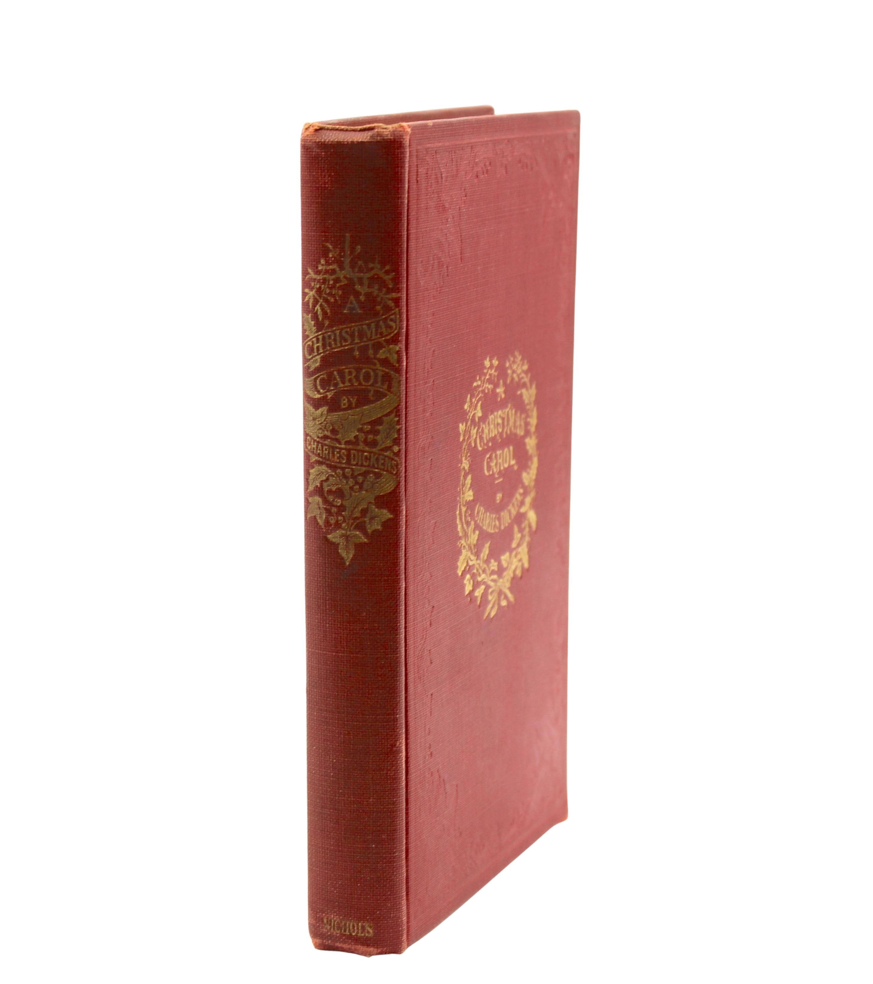 Dickens, Charles. A Christmas Carol. New York: H. S. Nichols, 1914. First Facsimile Edition. Octavo. In the publisher's original red cloth boards, blind stamped on front and back, gilt titles and wreath to front and spine. Illustrated. 
Presented is