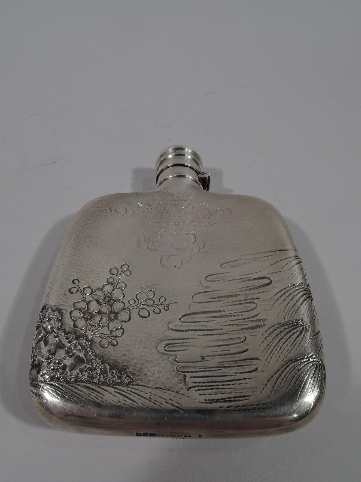 A sportsman’s flask with royal association. Made by Made by Gorham & Co. in Providence in 1883.

Hand-hammered sterling silver. Squarish with hinged and corked-lined cover. On front a finely chased and engraved scene depicting a hooked fish being