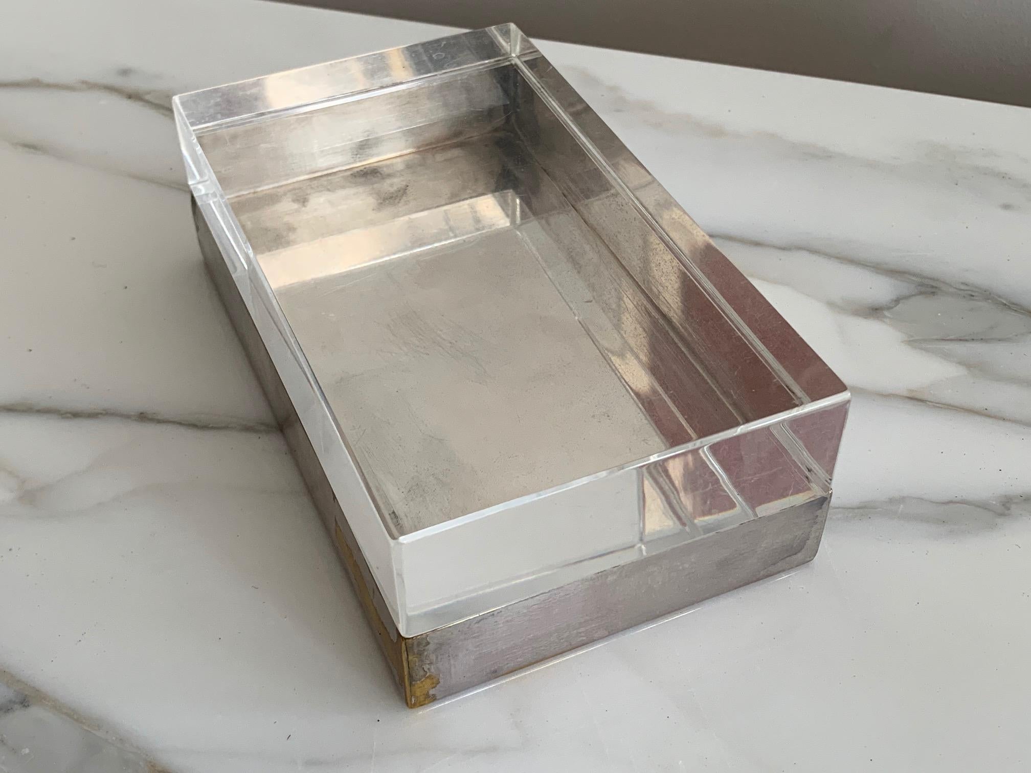 A beautiful and classic decorative box by Christofle, circa 1970s. Lucite and silverplated brass.