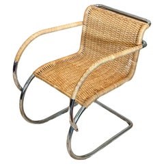 A chrome and wicker MR20 armchair by Ludwig Mies Van der Rohe for Stendig