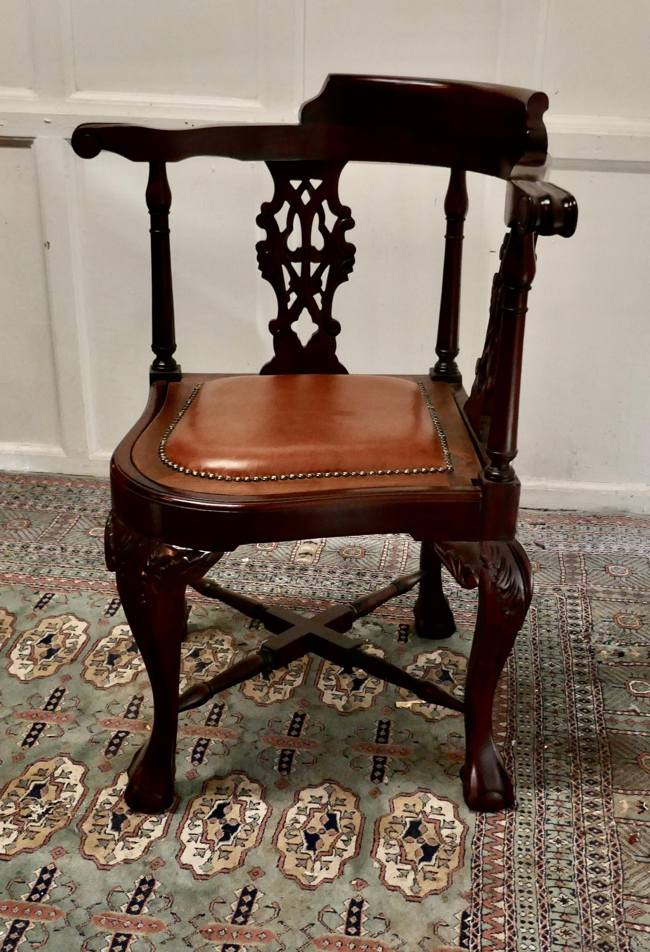 A Chunky Georgian style mahogany corner arm chair

A good heavy chair with a studded tan leather seat, on the back the chair has pierced splats, set on heavy carved cabriole stretchered legs 

A really lovely chunky Chair 33” high at the back,