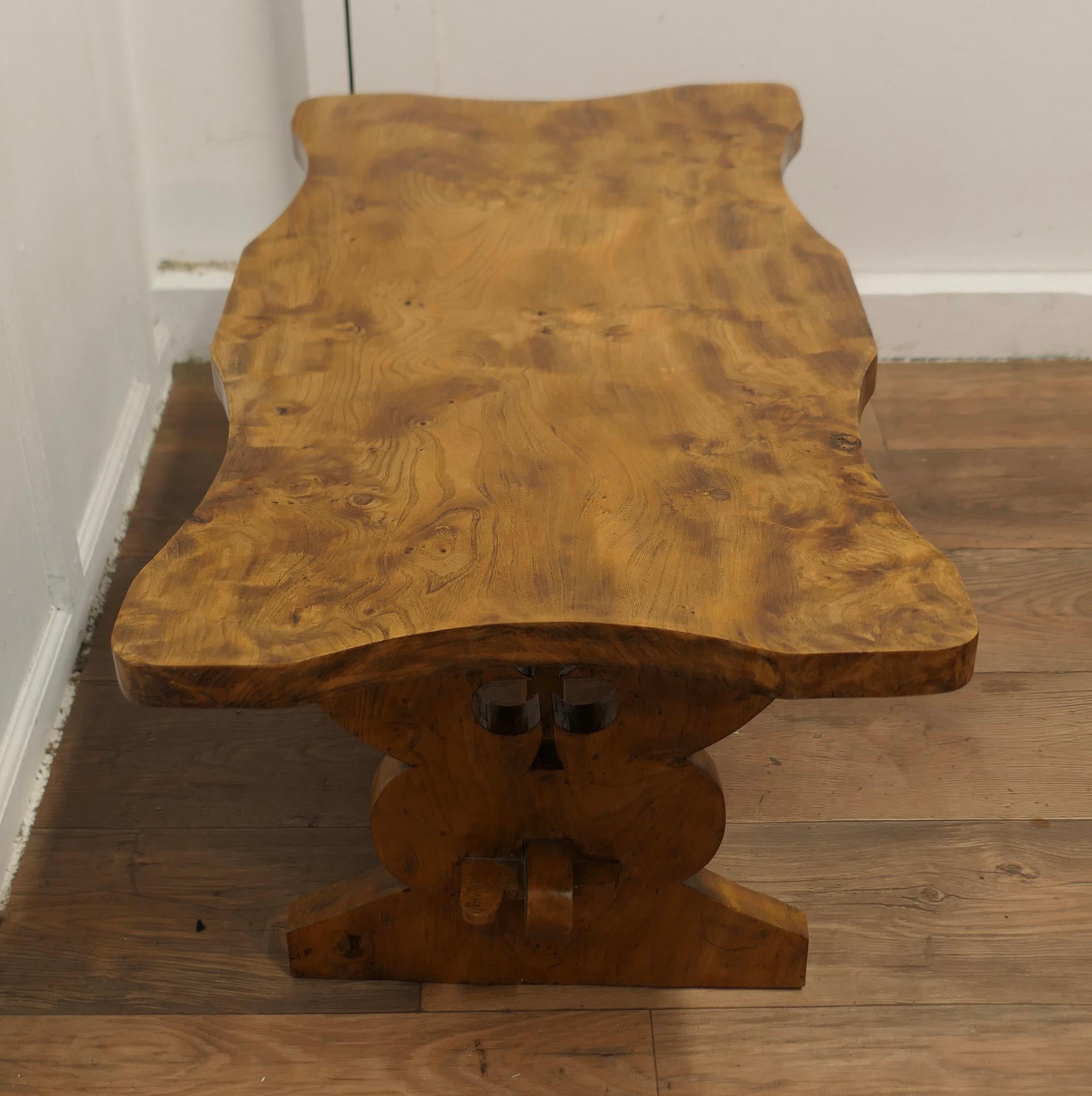 A Chunky Solid Elm Irish Coffee Table

This is a very sturdy table, made in the Farmhouse refectory style, it is made in solid elm in a scalloped shape which has a superb patina and an attractive grain it has a thick top and chunky legs carved with