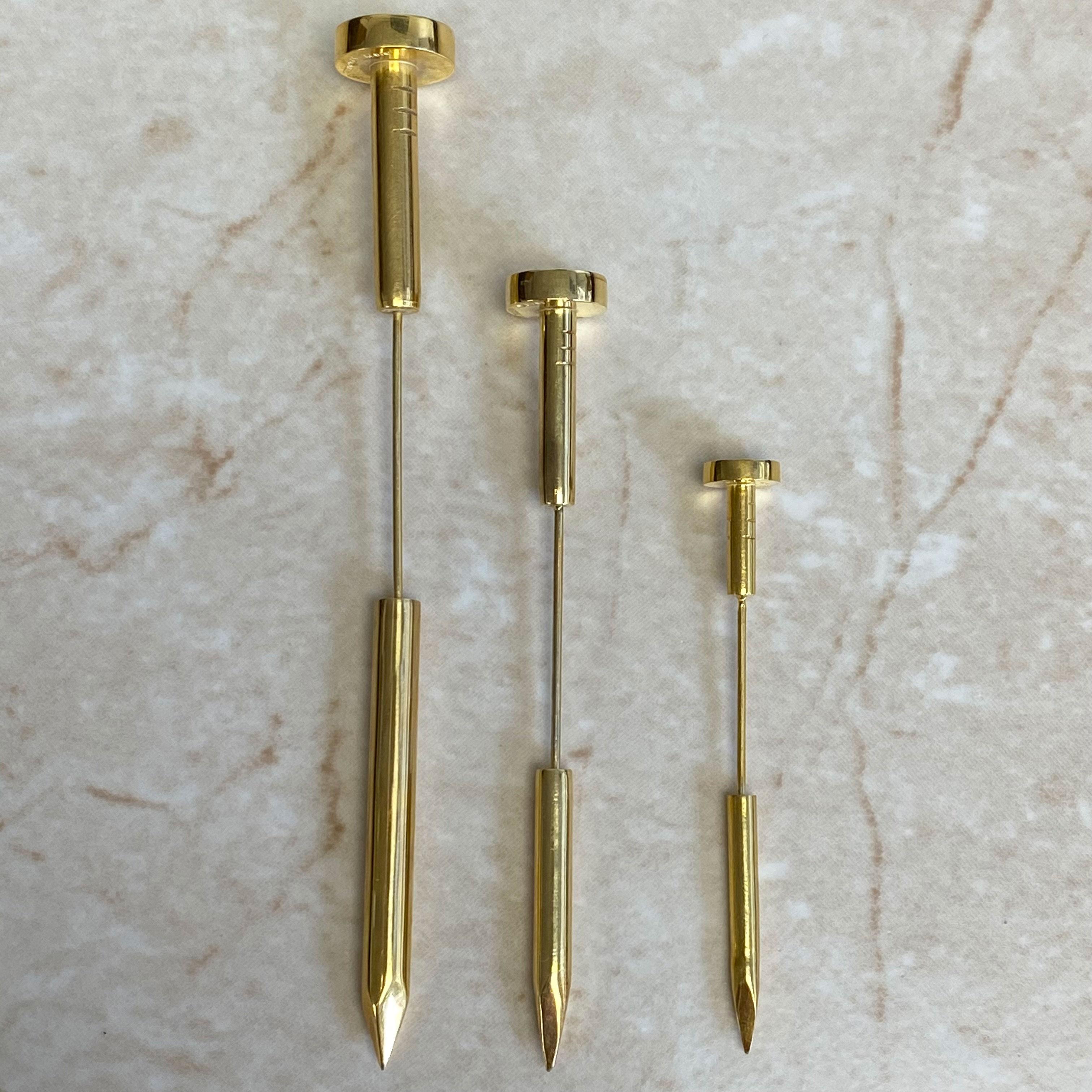 This exquisite set of three vintage Cartier Cipullo jabot pins showcases the innovative nail design that has become an iconic symbol of bold, avant-garde jewelry. Handcrafted in the 1970s, these pins are meticulously crafted in 18k yellow gold,