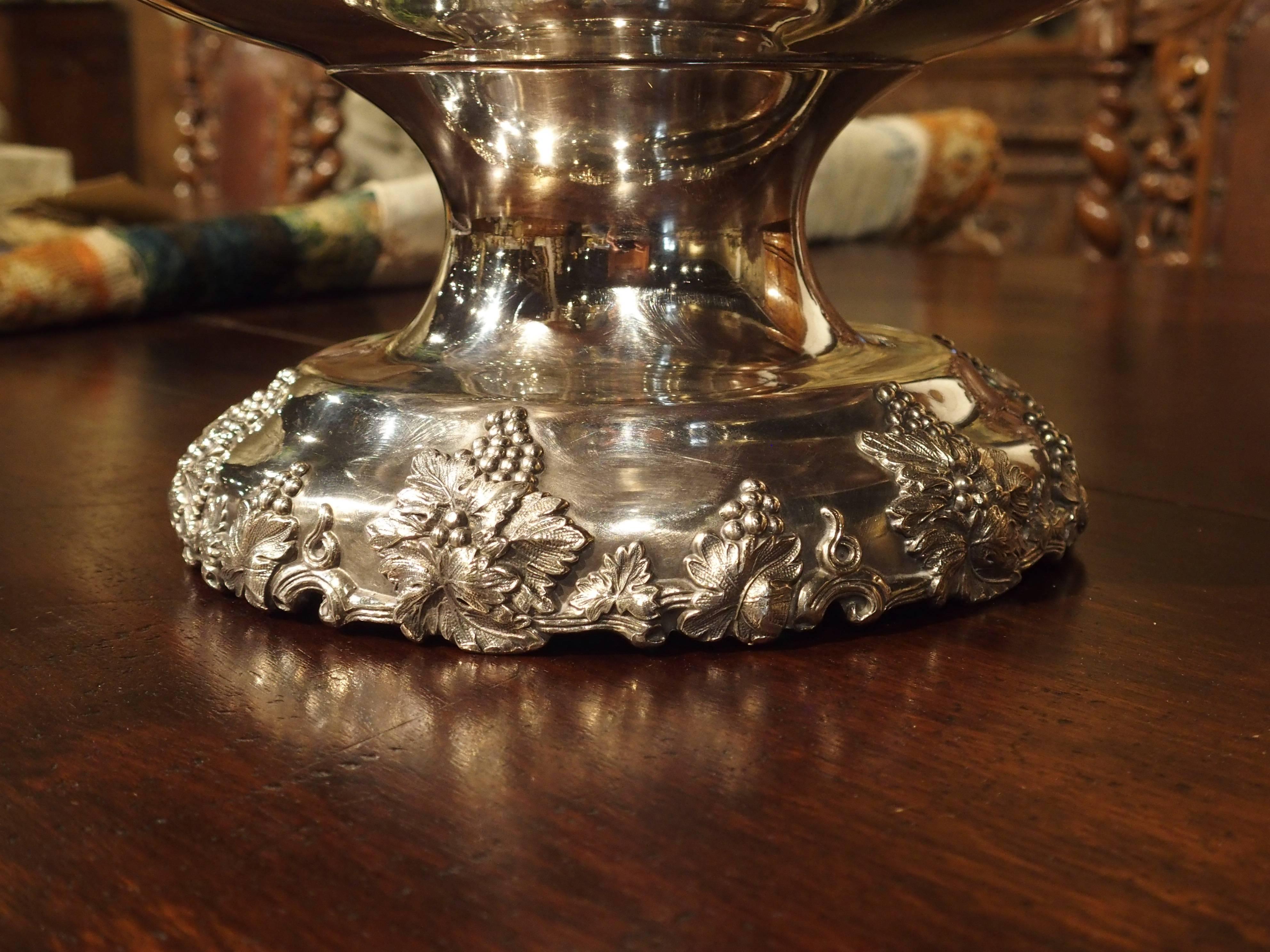 This magnificent silver plated punch bowl and tray have detailed motifs of various sized grape clusters with leaves around all of its outer borders. Interspersed throughout these motifs are varying sizes and shapes of C-Scrolls. Punch bowls with