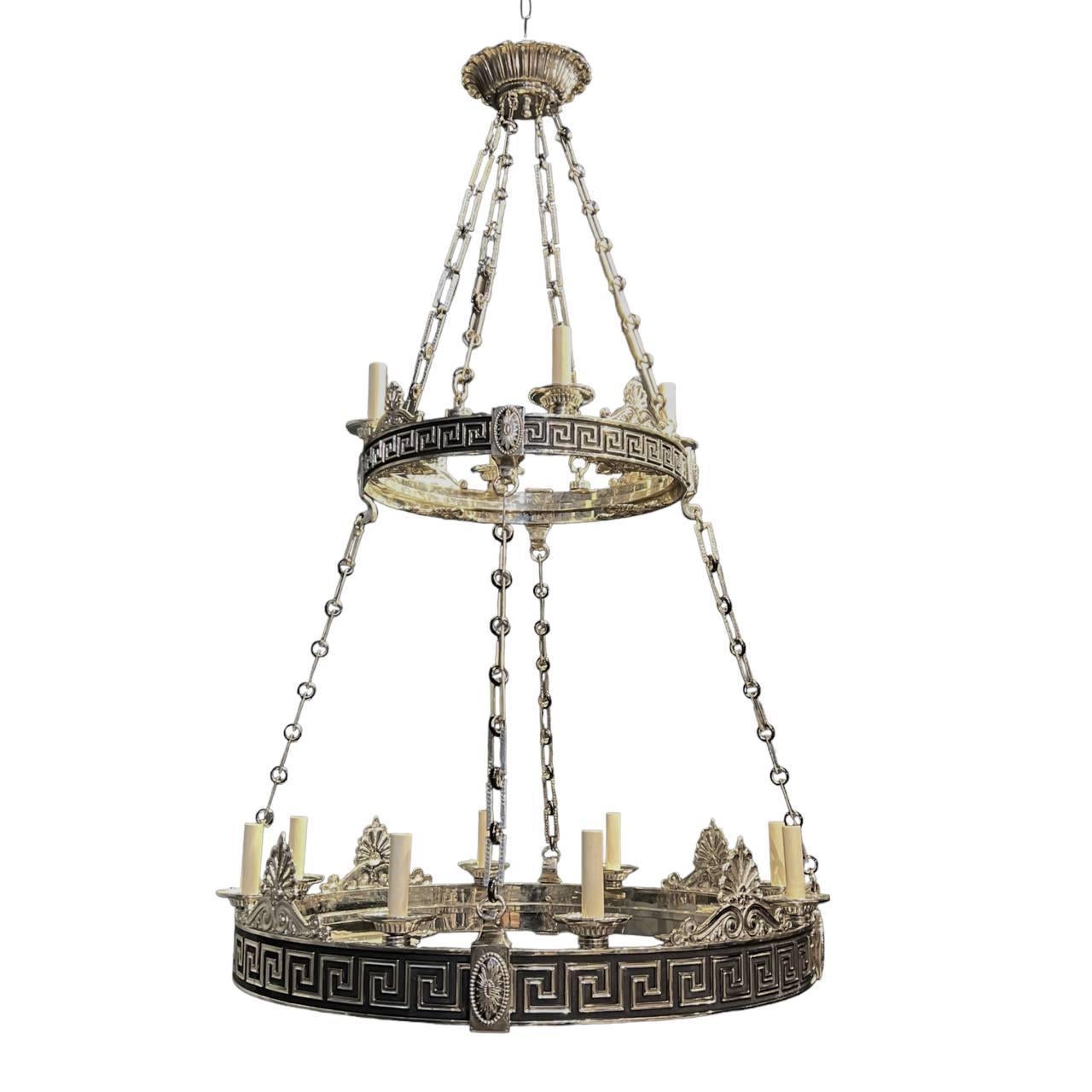 A pair of circa 1900's  Neoclassic style two tiers 16 lights chandelier with Greek key design and black patina