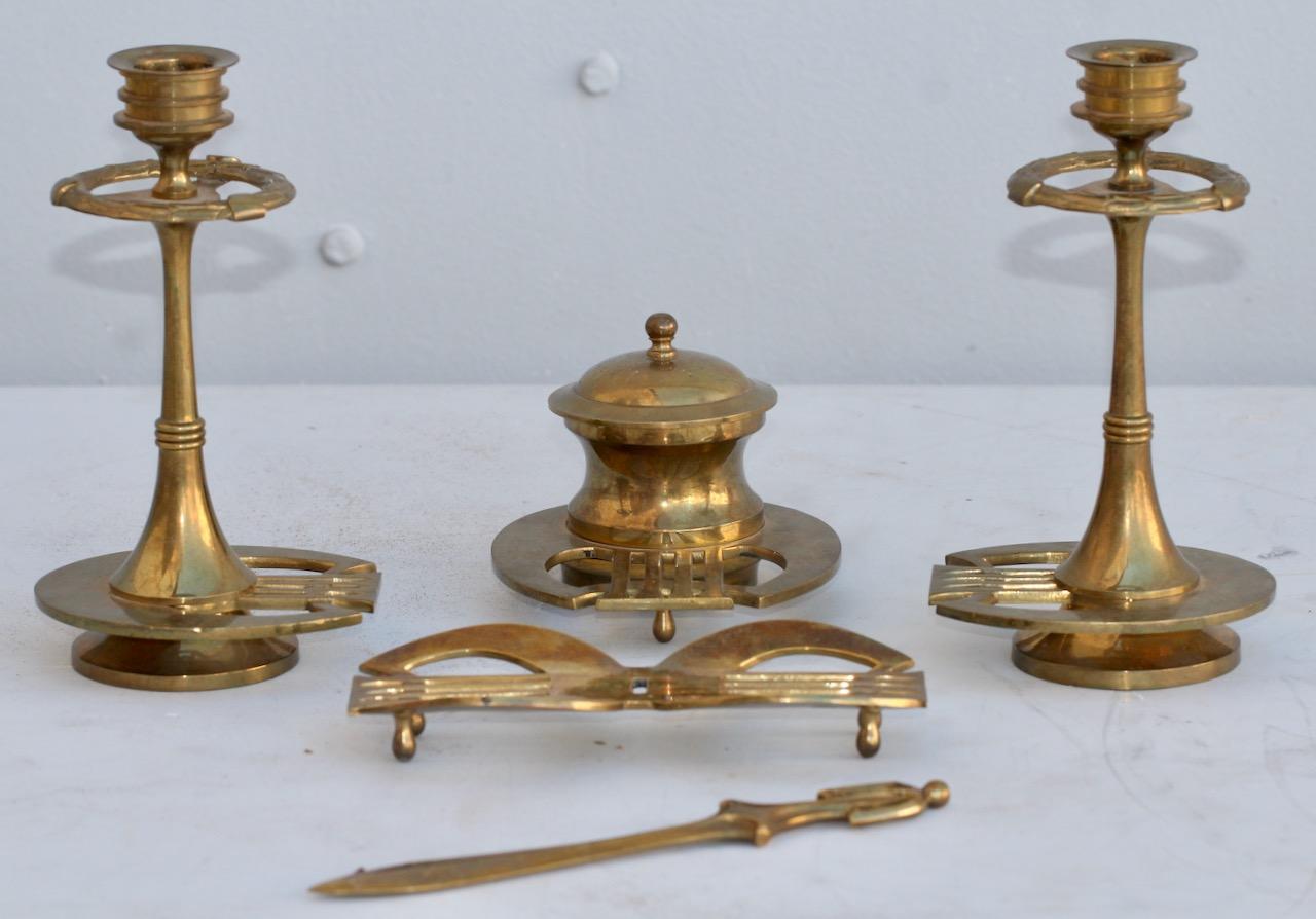 A circa 1910 Jugendstil travelling desk set
Composed of a pair of candlesticks, an inkwell with its original glass container, a letter-opener and a pen receiver.
In original fitted case.