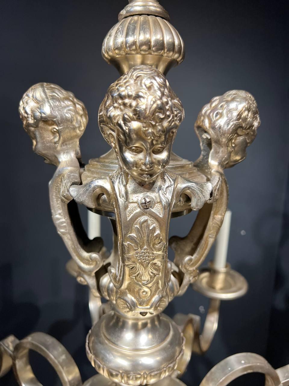 1920's Silver Plated Caldwell 8 Lights Chandelier with Cherubs  In Good Condition For Sale In New York, NY
