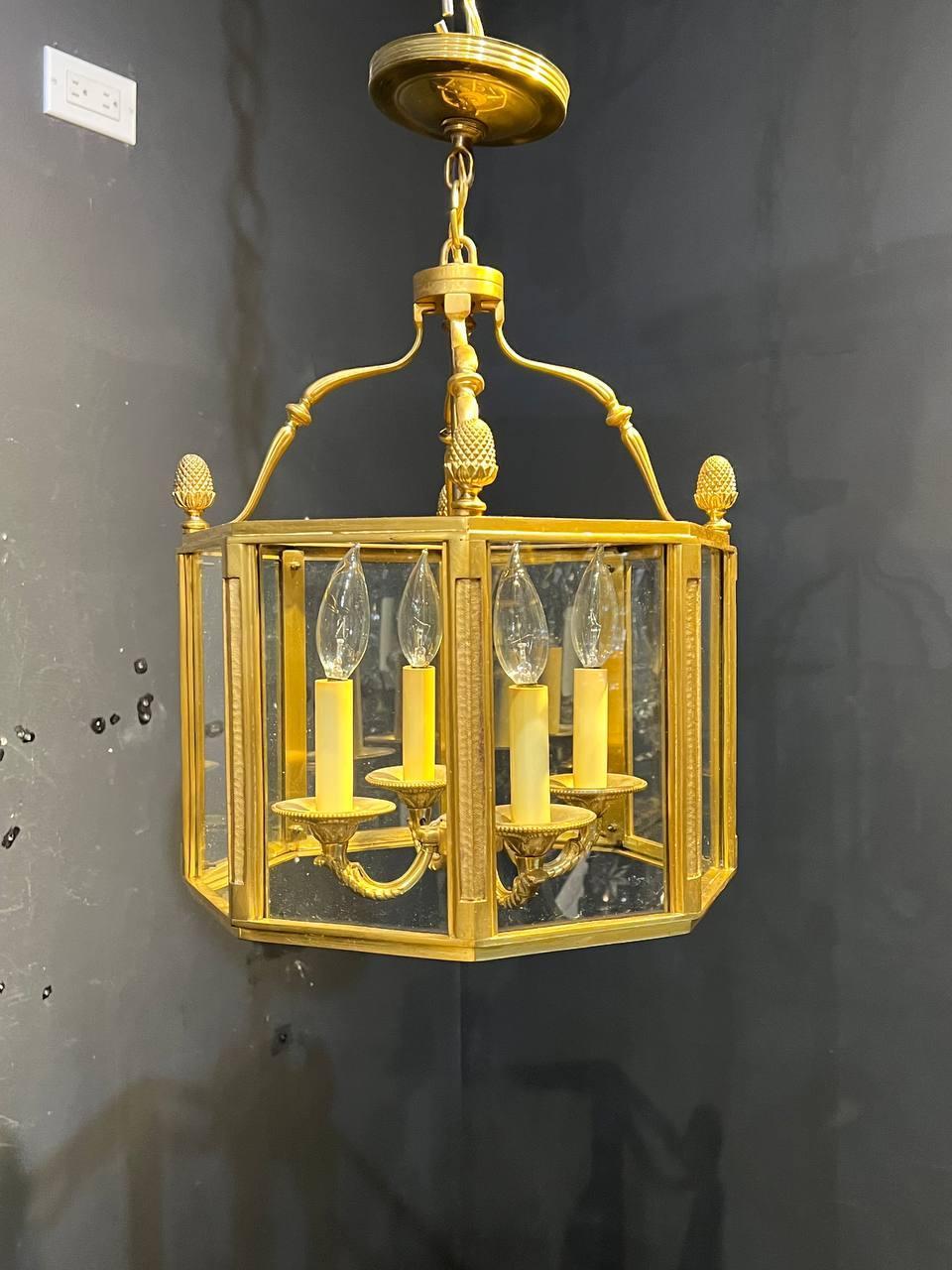 A circa 1930's French gilt bronze Empire style indoor lantern with glass panels inset.