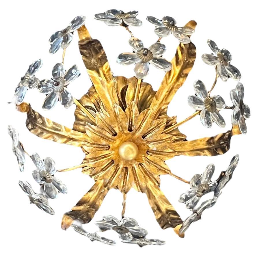 A circa 1930's French gilt metal light fixture with crystal flowers (4 interior lights)