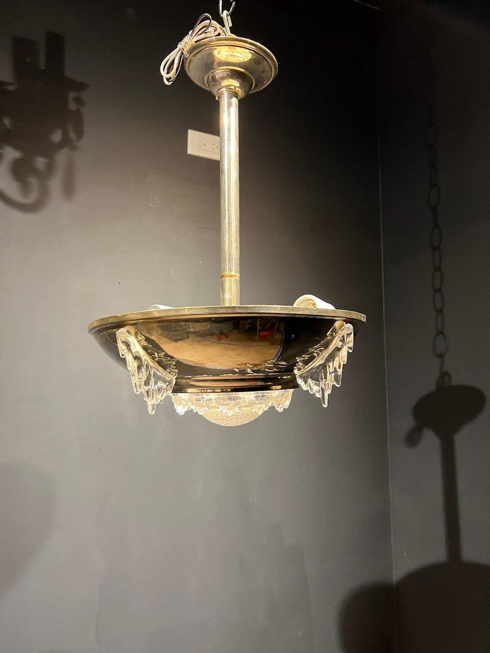 A circa 1930's French Art deco small light fixture with molded glass inset.