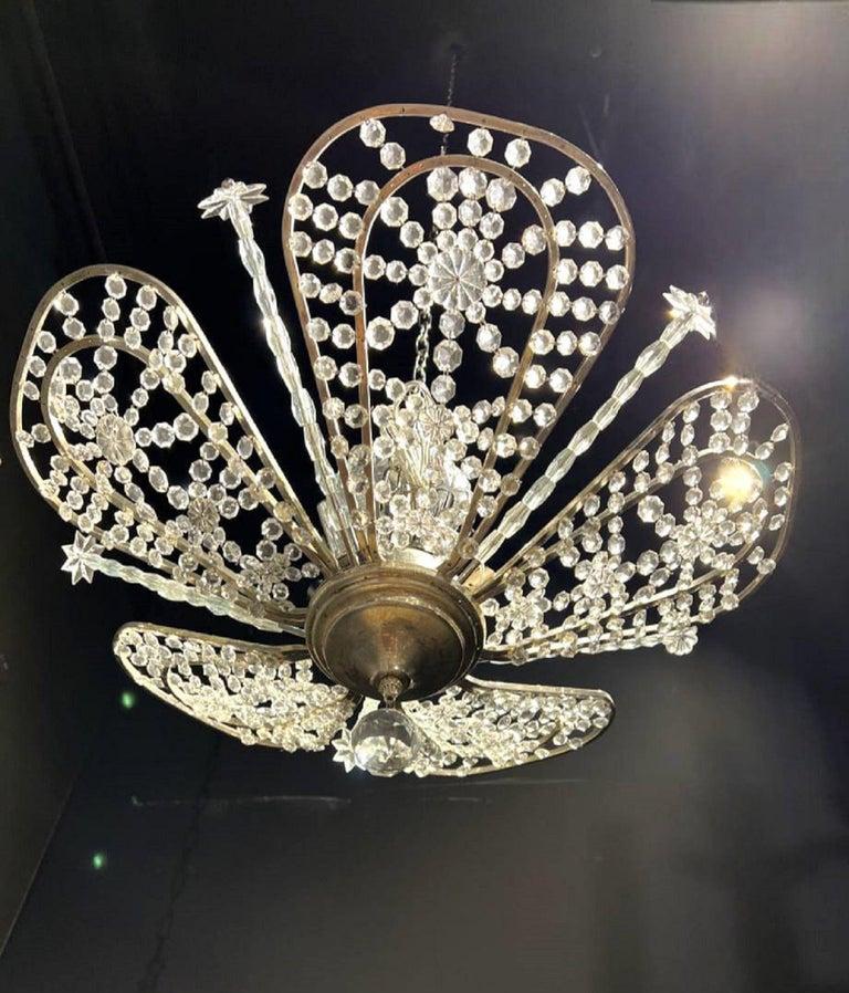 A circa 1930's French silver plated light fixture with crystals. Available pair 