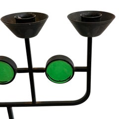 A circa 1970's Swedish iron candlestick with green glass.  Measurements: Height: