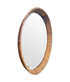 Ein runder Spiegel aus geflochtenem Rattan von Cantu, Roma, aus den 1950er Jahren mit Messingdetails
