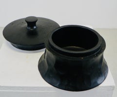 A circular wooden box with a gouged pattern lid France 1950