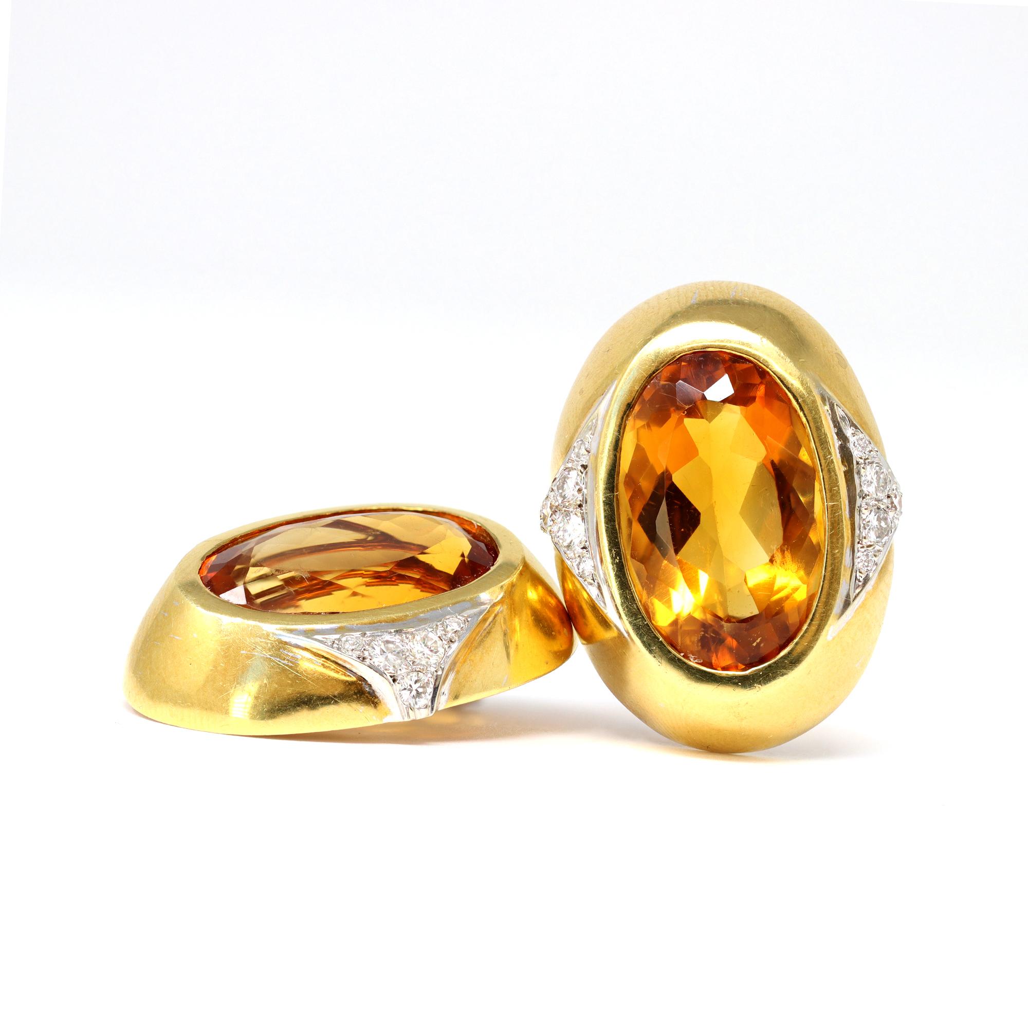 A sunny pair of clip on earrings featuring an oval shape faceted citrine adorned with diamonds. The earrings circa 1980 are set in 18 karat yellow gold with an estimated weight of 1.20 carats of diamonds, GH color and VS clarity. The citrines weight