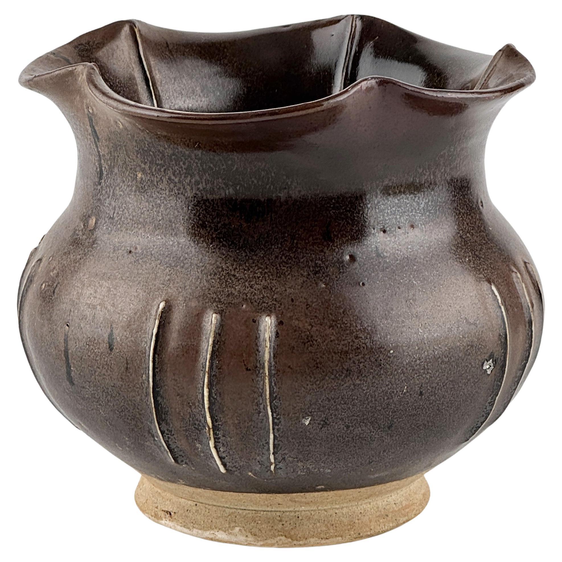 A Cizhou Blackish Brown Glazed Stoneware Foliate Jar, Northern Song Dynasty