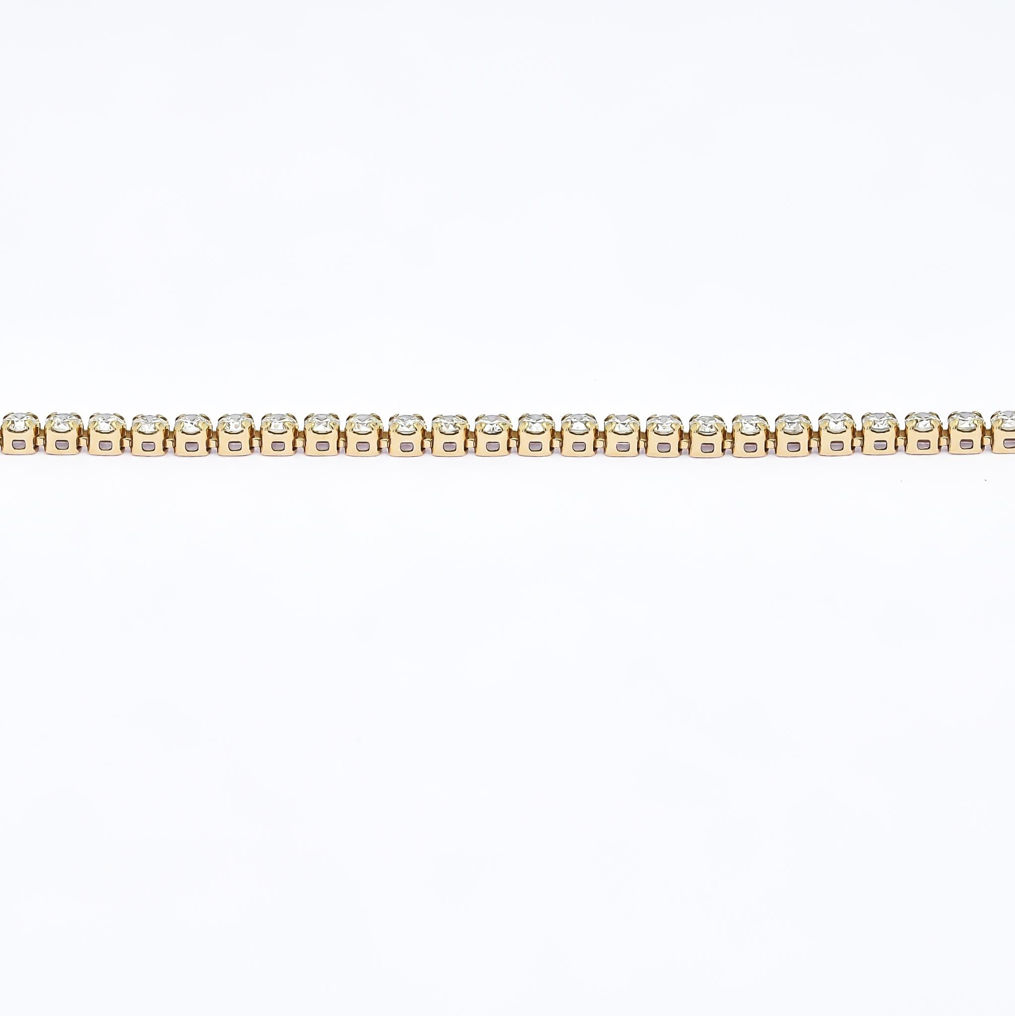 Indulge in the timeless allure of this classic 1.50 carat four-prong tennis bracelet. Meticulously crafted in 18K rose gold, it embodies elegance and sophistication. Each natural diamond, meticulously selected for its exceptional quality, is