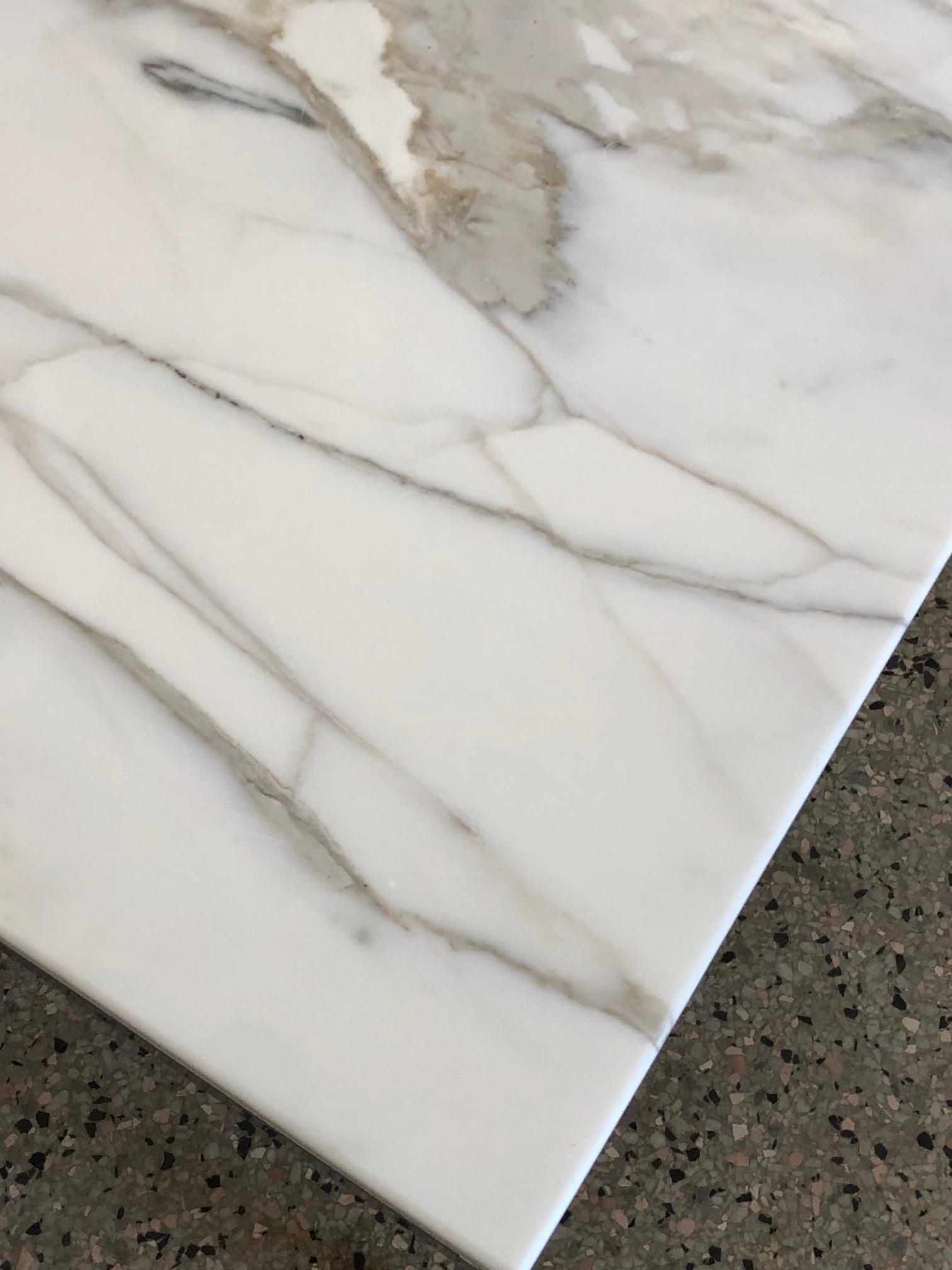 A classic Knoll Carrara marble occasional table. Measures: 27 x 27 x 17