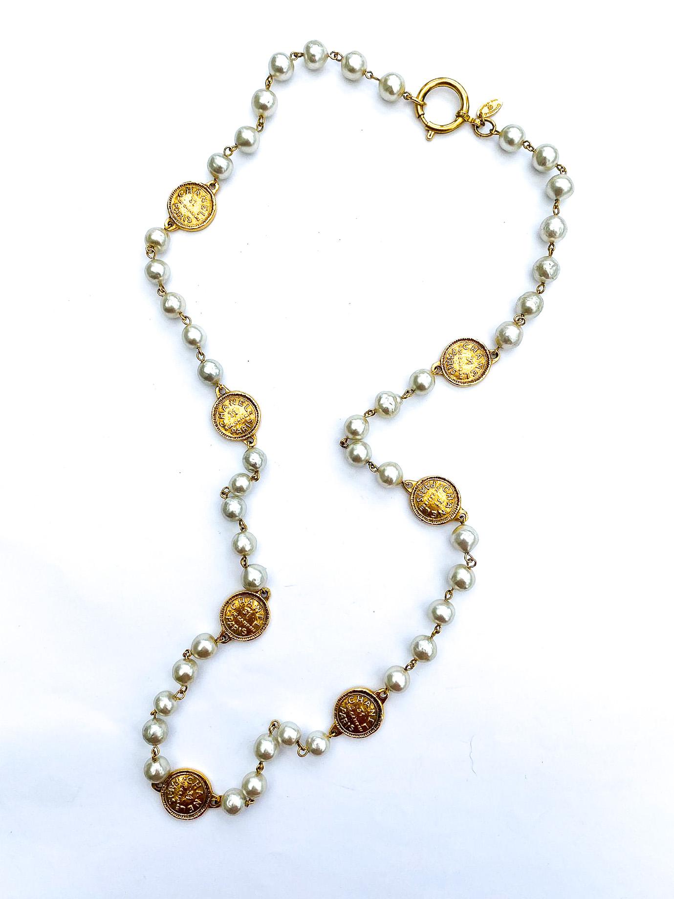 A classic rope of baroque pearls, with medallions/coins, Chanel, Paris 1980s. For Sale 7