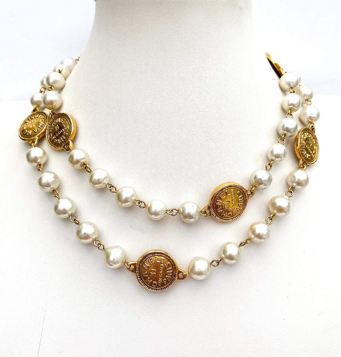 Women's A classic rope of baroque pearls, with medallions/coins, Chanel, Paris 1980s. For Sale