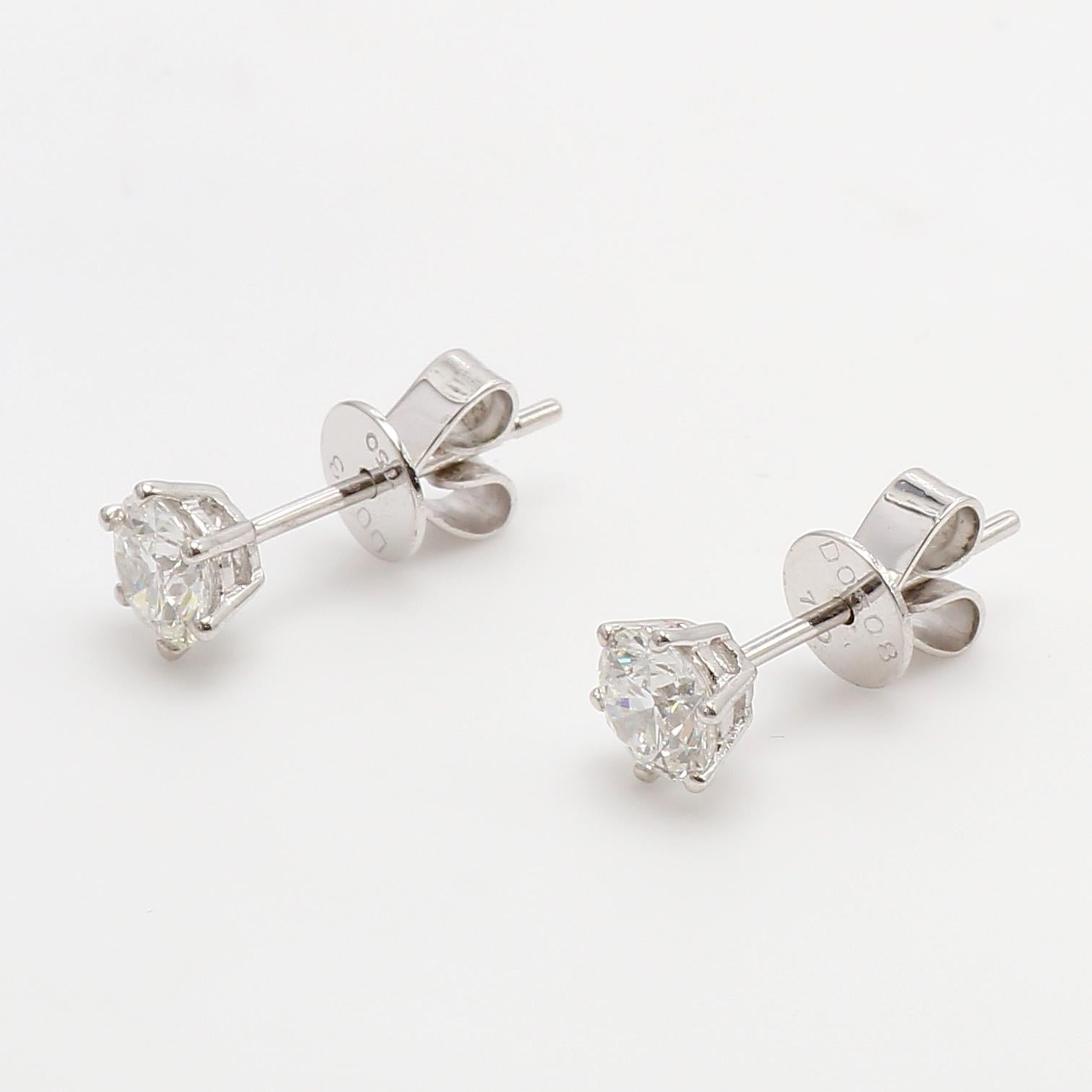 Classic Diamond Stud Earrings, set in 18K White Gold.
Round Brilliant Cut White Diamonds totaling 1.038ct G Color, VS2 Clarity
6 ProngSolitaire Studs. Designer Earrings. Beutifull Shimansky South African Diamonds