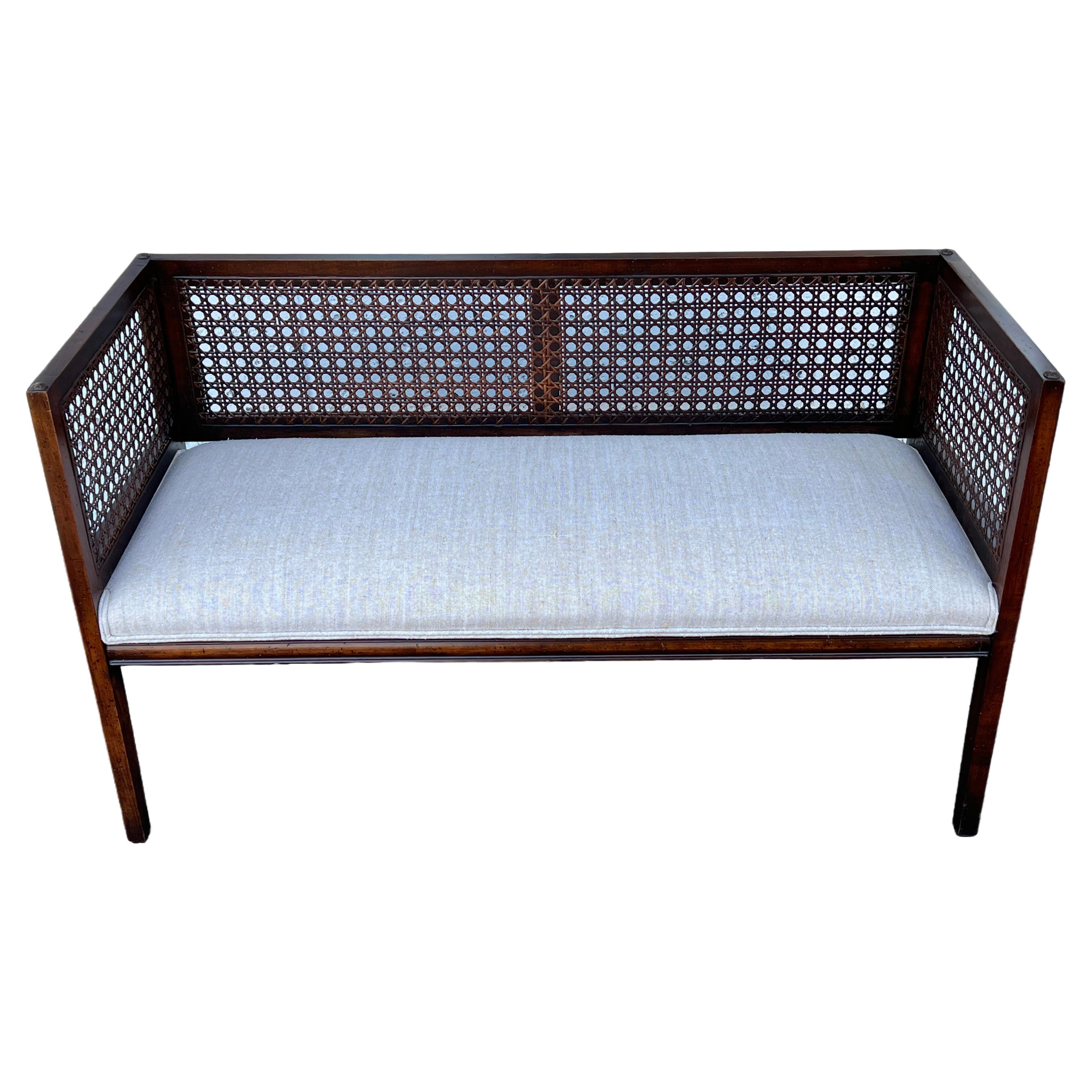 A Classic Upholstered Bench With Caned Back For Sale