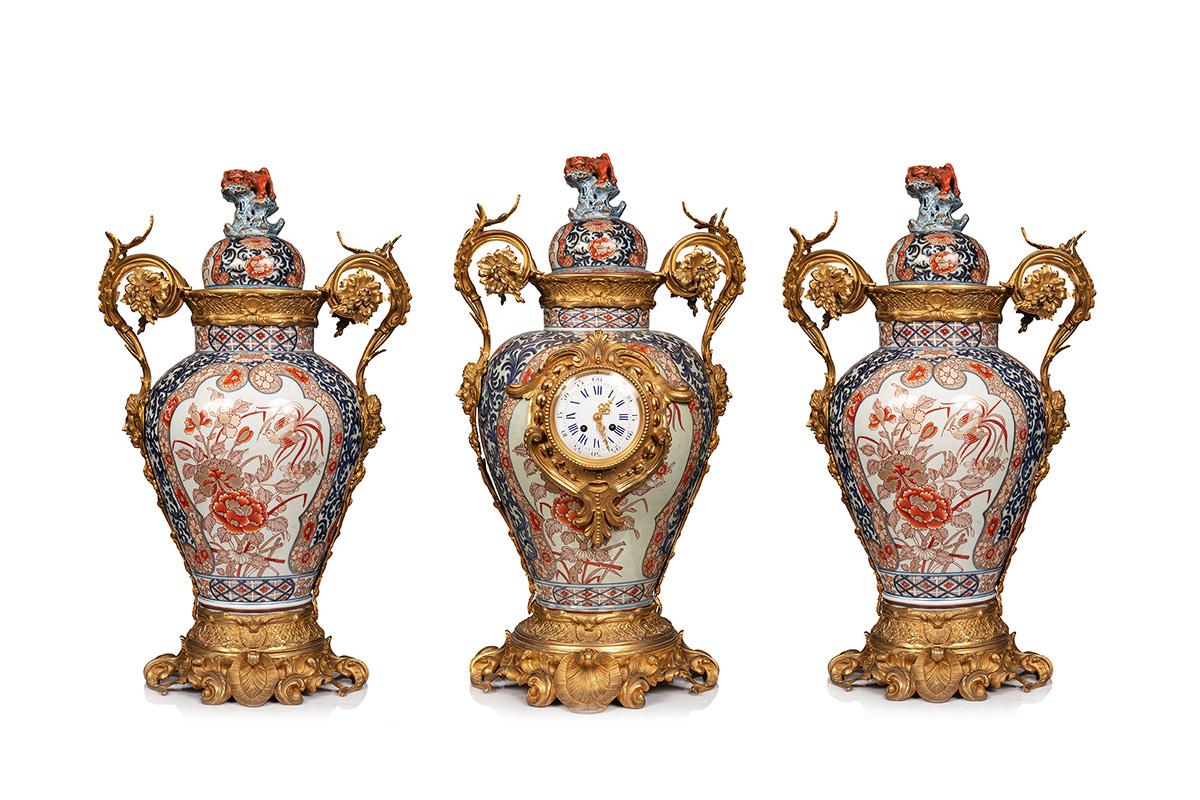 Clock set three pieces in Imari porcelain and bronze . this clock set is rare ,you can use it with the candelabras , you can take off this candelabras and put the lid porcelain on the top ,
you have two clock set for the price of one , its a very