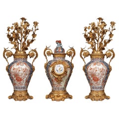 Antique A clock set 3 pieces imari porcelain and bronze