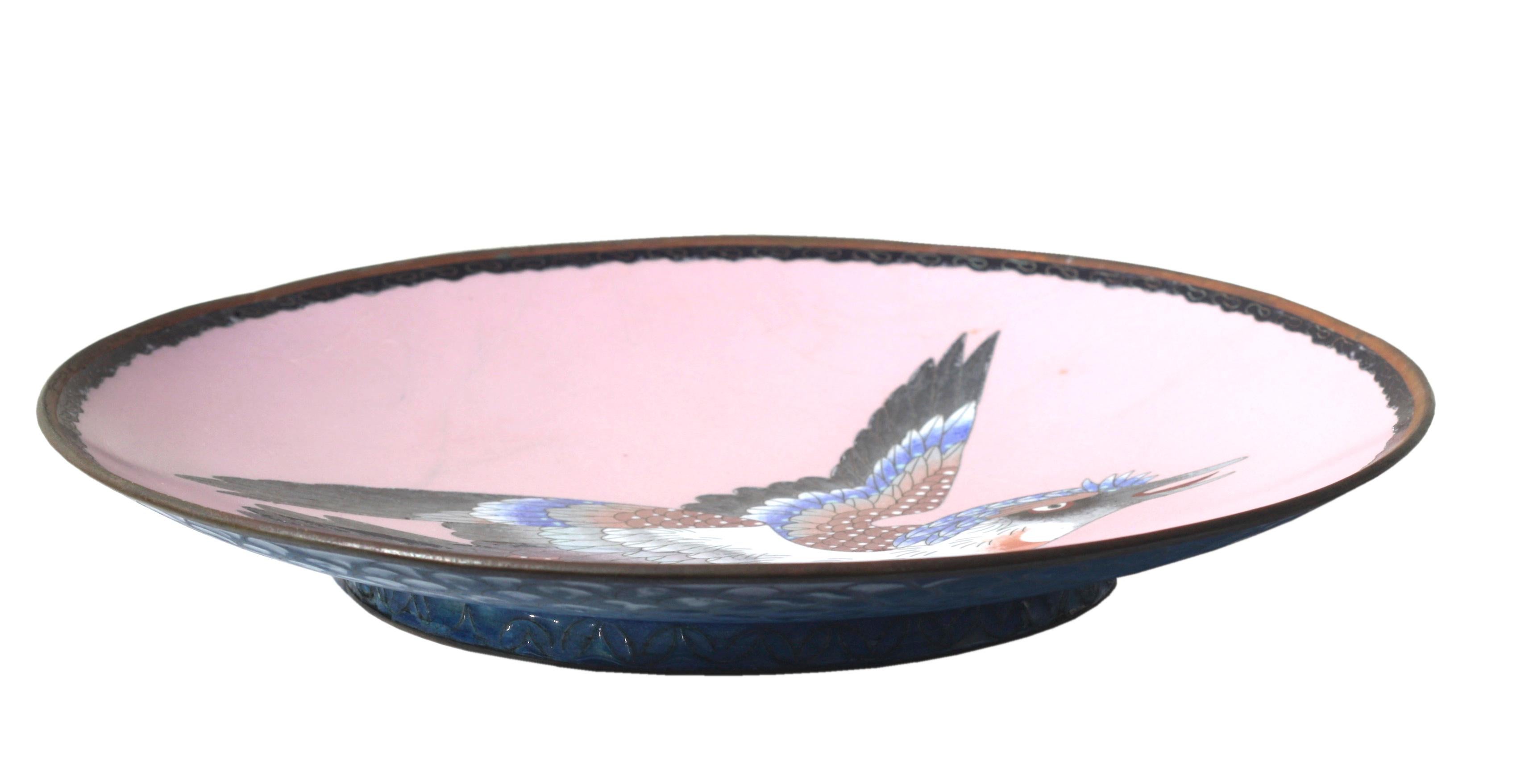 
A Cloisonne Dish
Meiji period (1868-1912)
decorated with a lively Falcon reserved on a light pink ground
diameter 11 3/4 inches