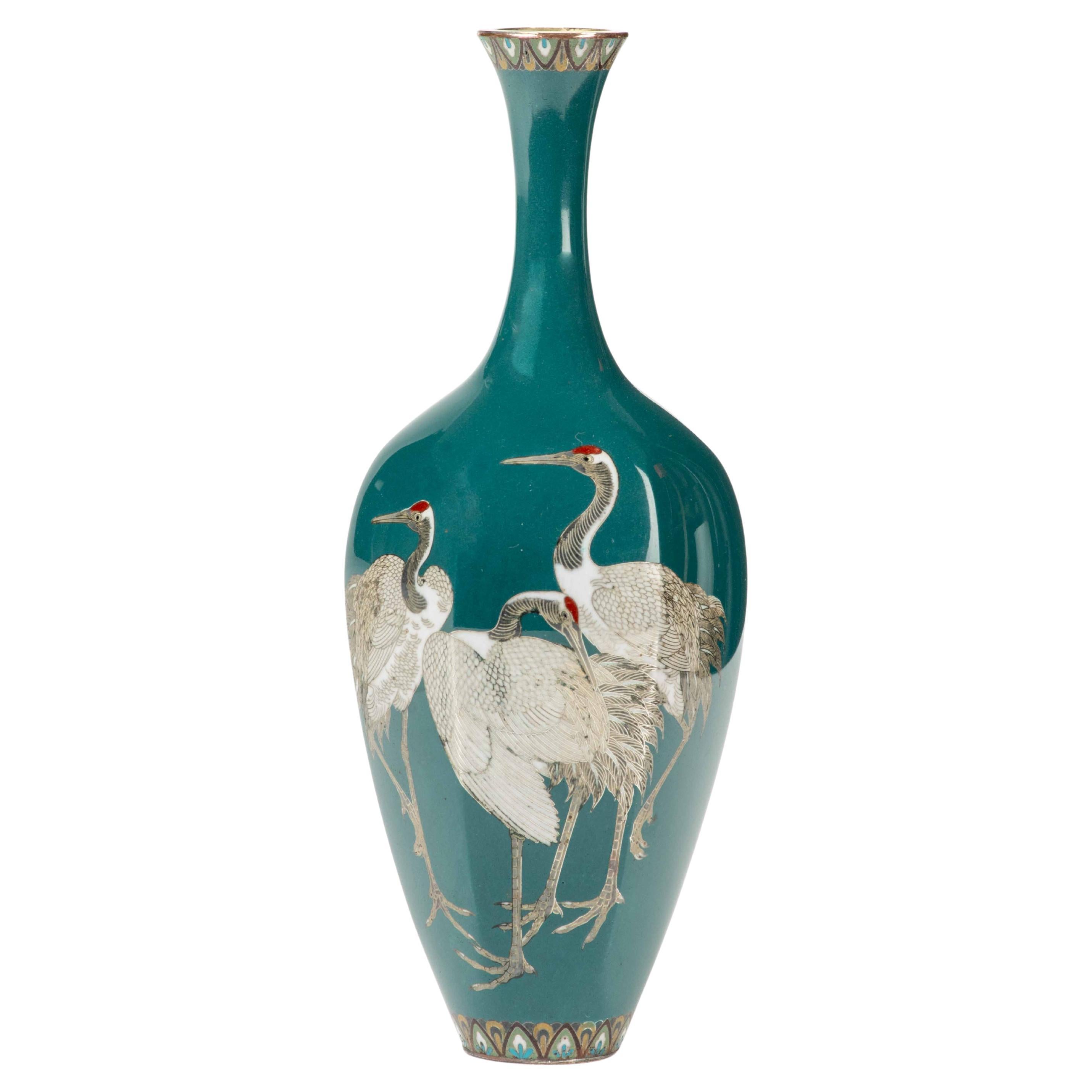 A cloisonné vase depicting three Manchurian cranes on a turquoise ground For Sale