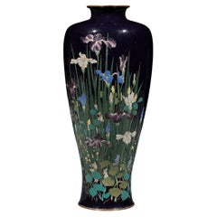 A cloisonné vase with a composition of irises and aquatic plants
