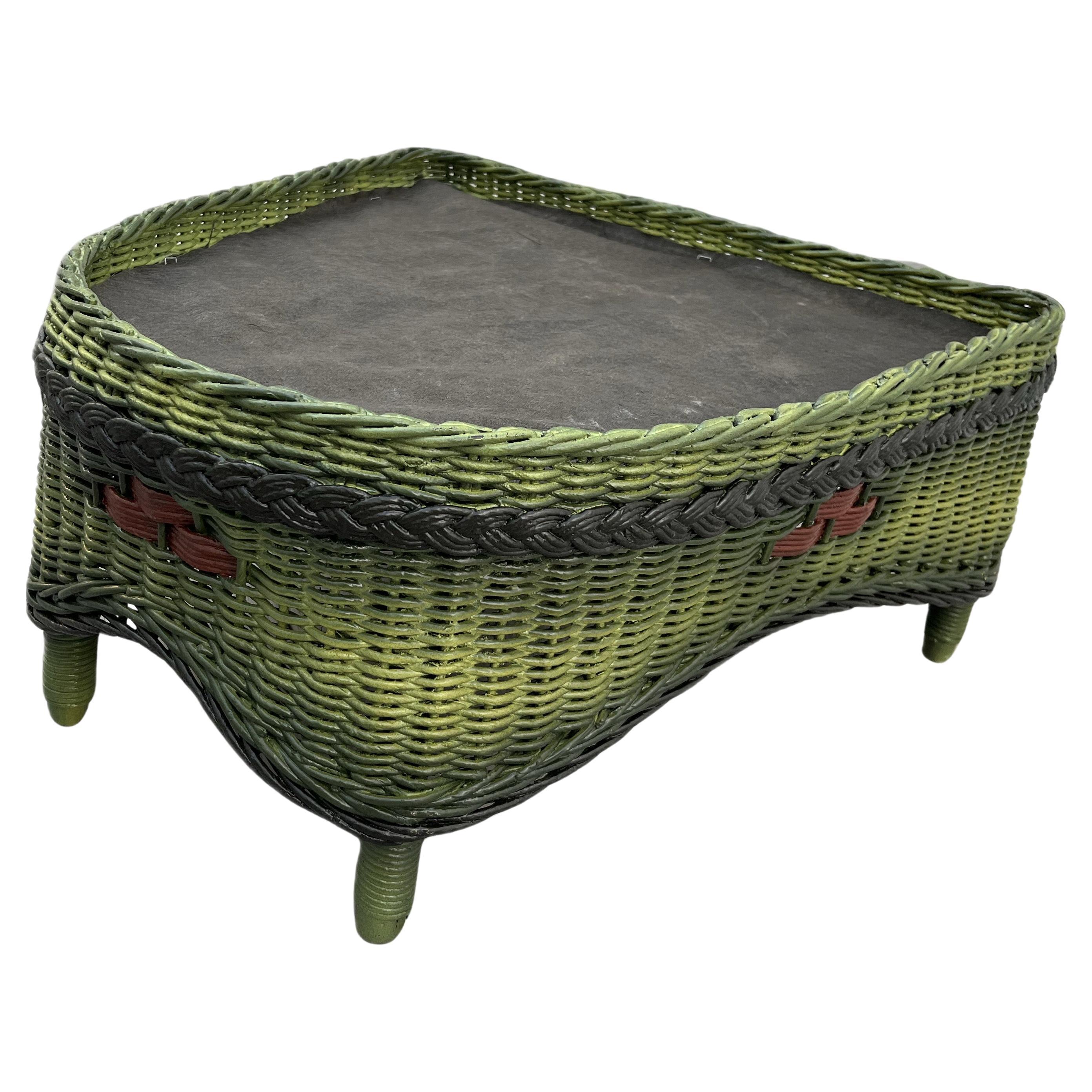 A Close Woven Wicker Ottoman in French Green Finish with Colored Accents For Sale